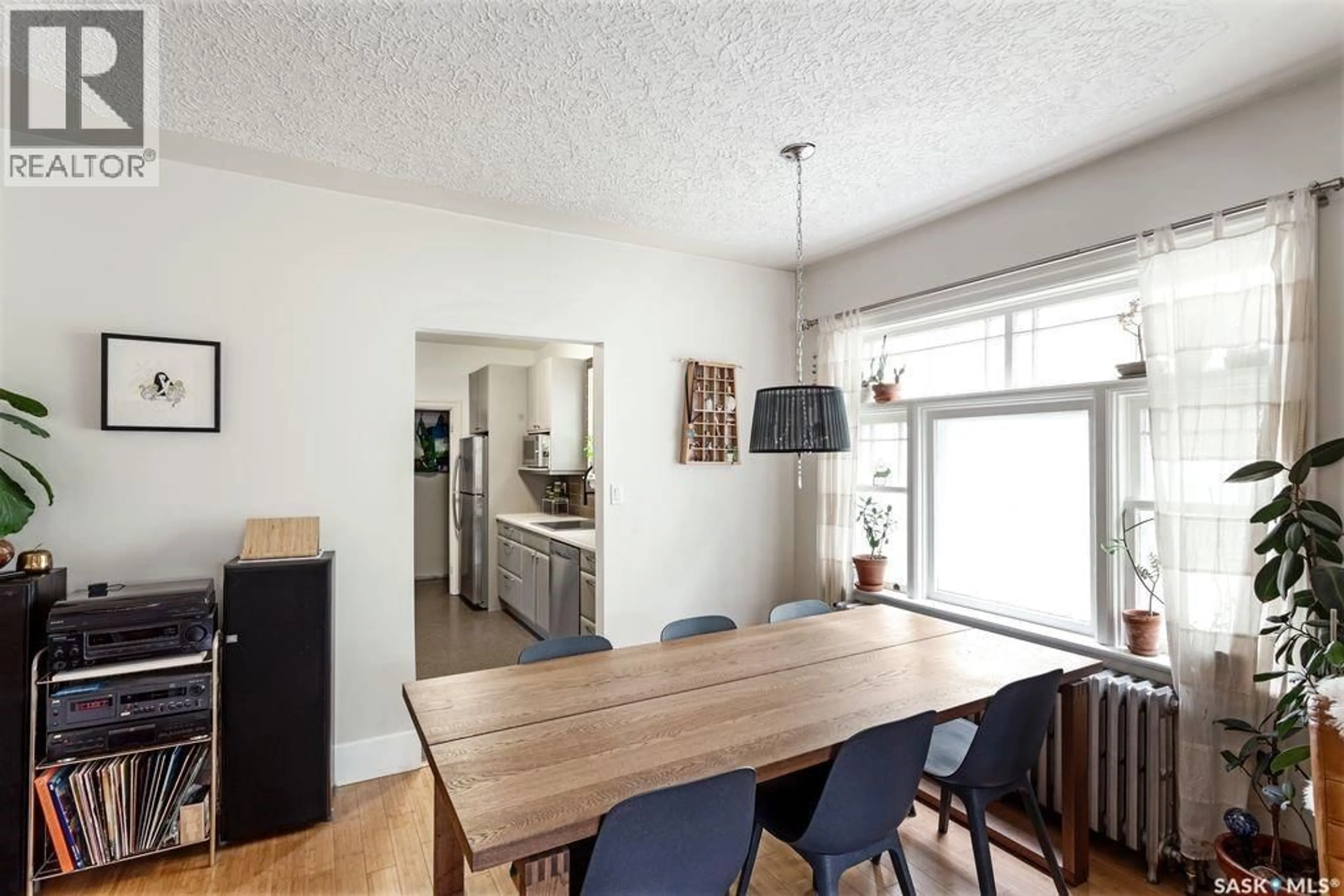 Dining room, wood/laminate floor for 314 E AVENUE N, Saskatoon Saskatchewan S7L1R8