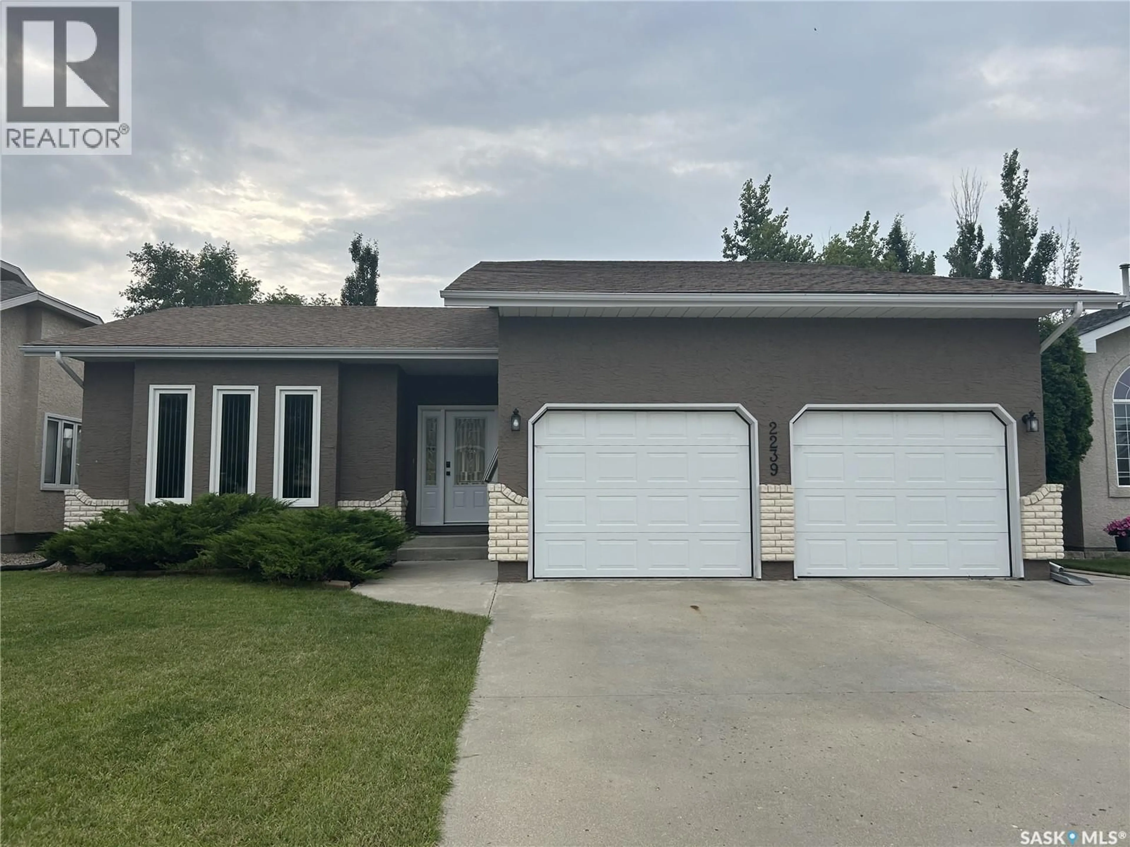 Home with vinyl exterior material, street for 2239 NEWCOMBE DRIVE, Estevan Saskatchewan S4A2S5