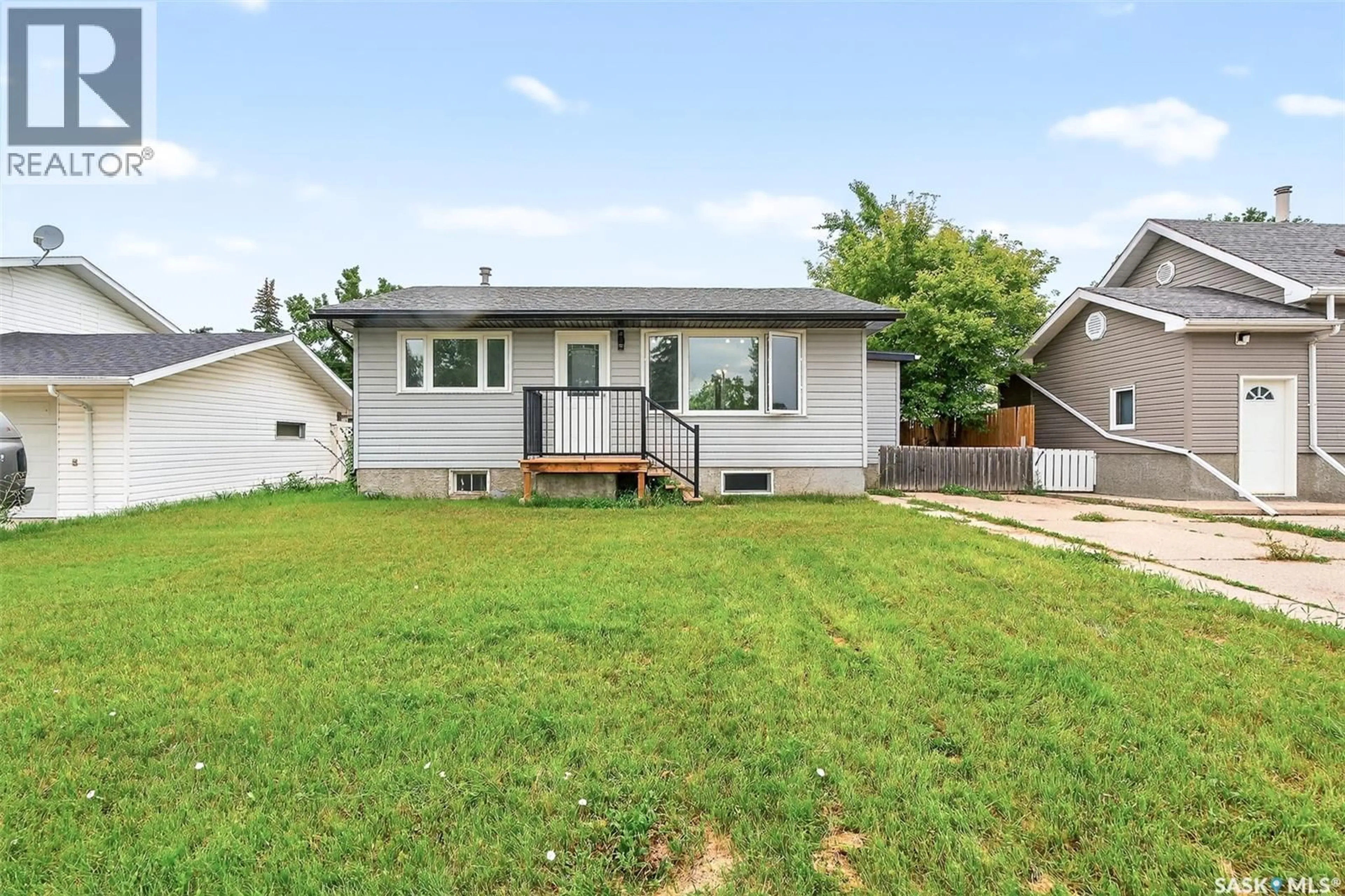 Home with vinyl exterior material, street for 1114 CARIBOU STREET, Moose Jaw Saskatchewan S6H7K6