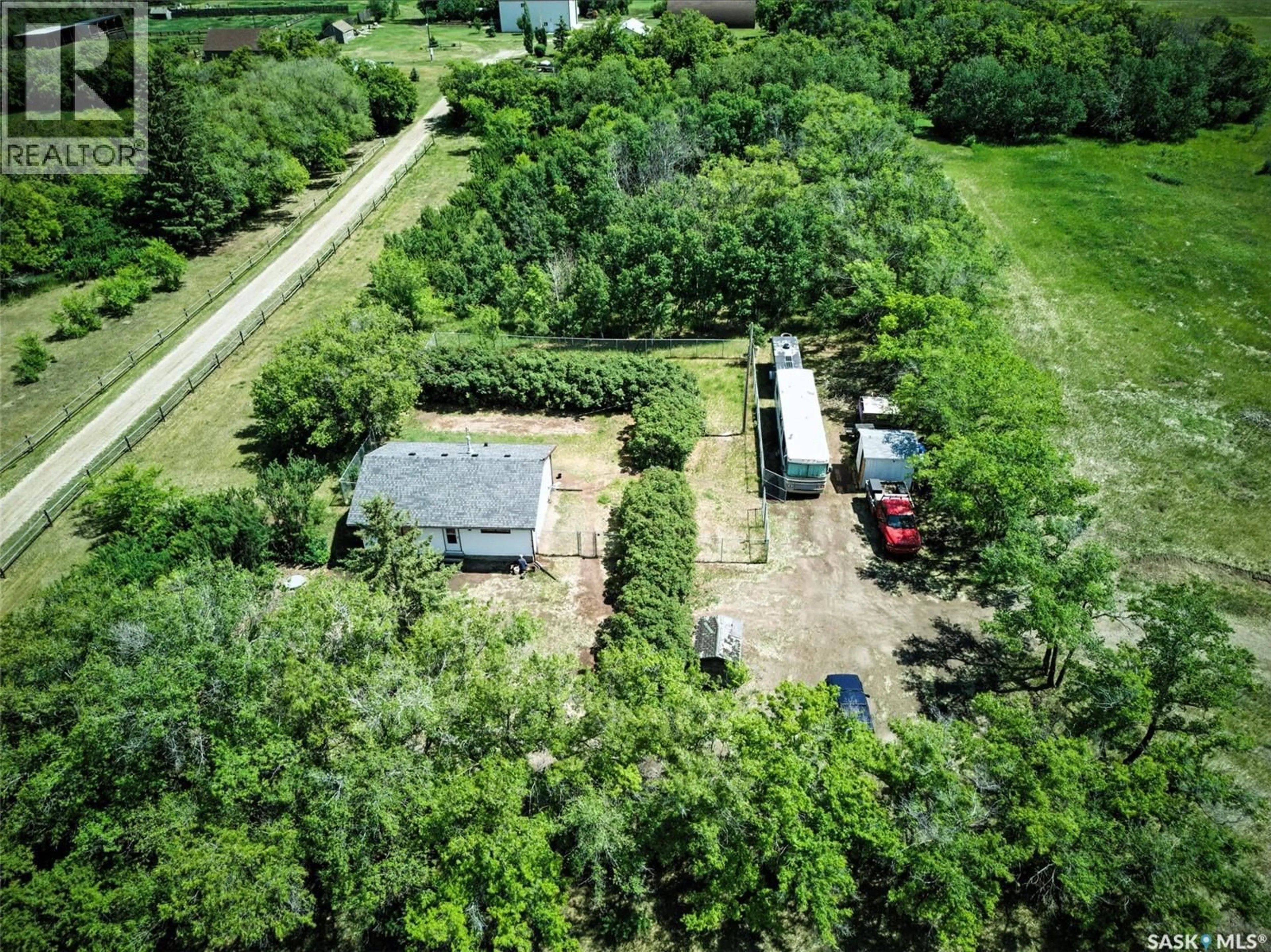 A pic from outside/outdoor area/front of a property/back of a property/a pic from drone, forest/trees view for MCKENZIE ACREAGE, Dundurn Rm No. 314 Saskatchewan S7C0E2