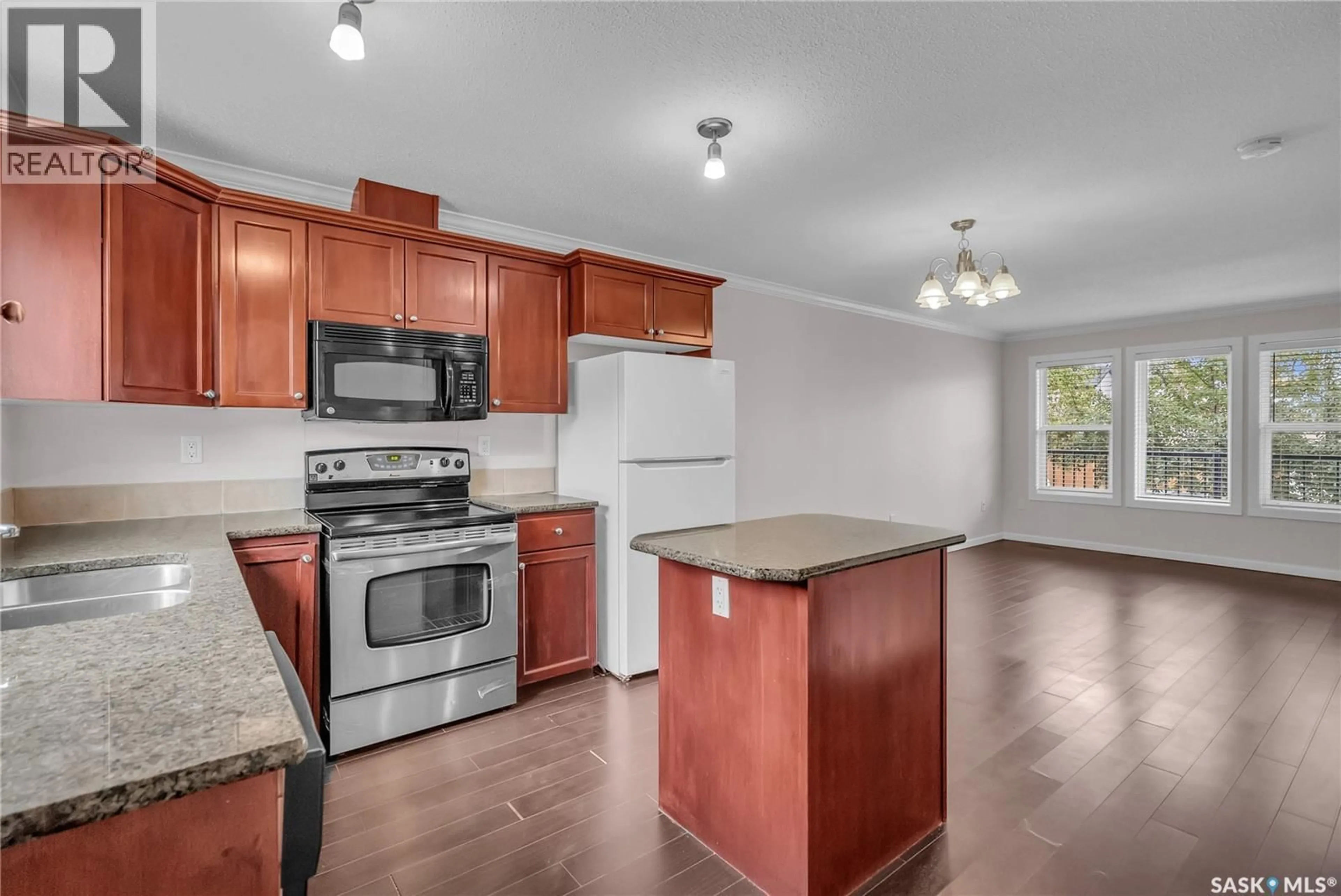 Open concept kitchen, wood/laminate floor for 109 315 HAMPTON CIRCLE, Saskatoon Saskatchewan S7R0J7
