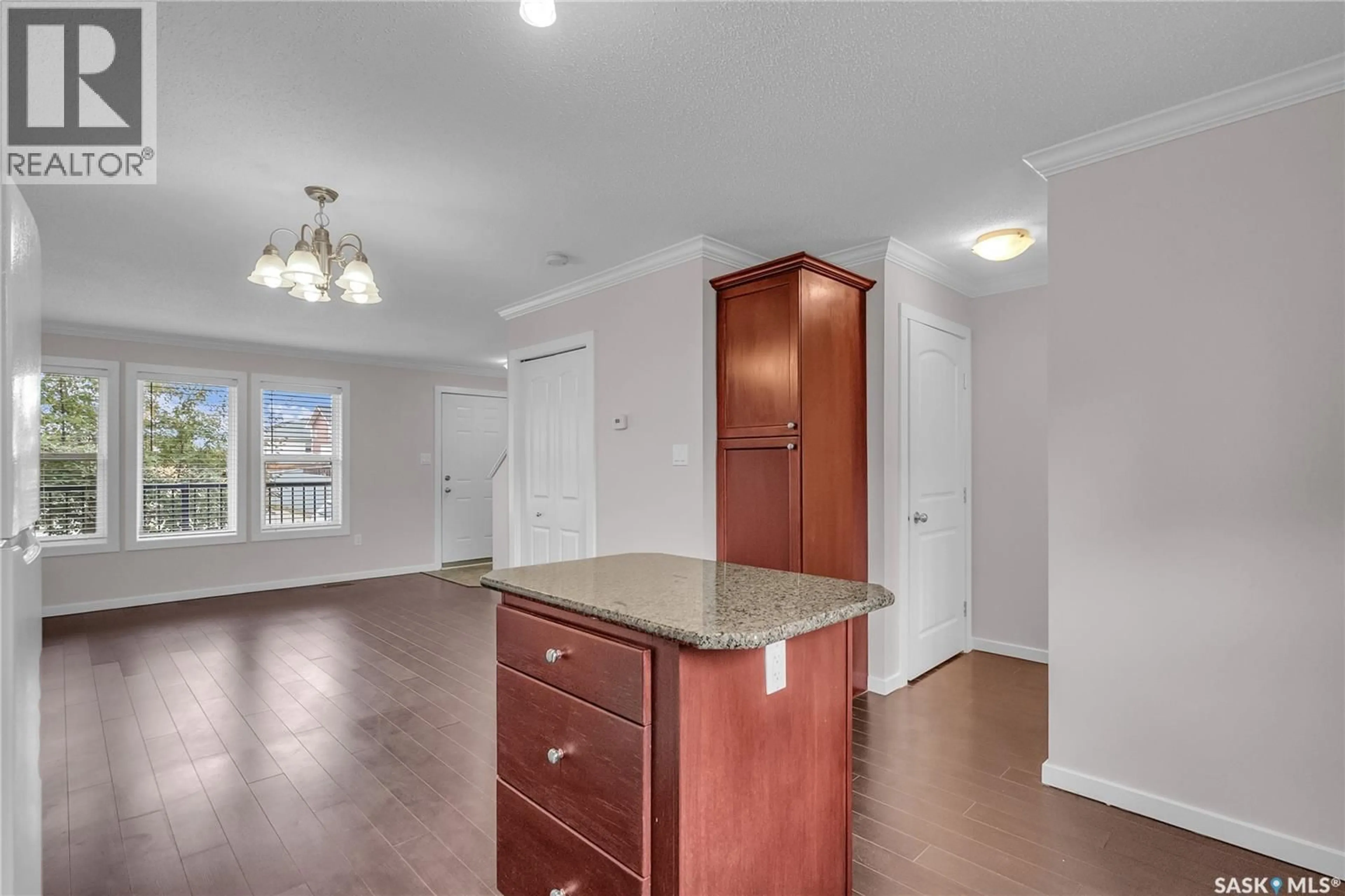 Open concept kitchen, wood/laminate floor for 109 315 HAMPTON CIRCLE, Saskatoon Saskatchewan S7R0J7