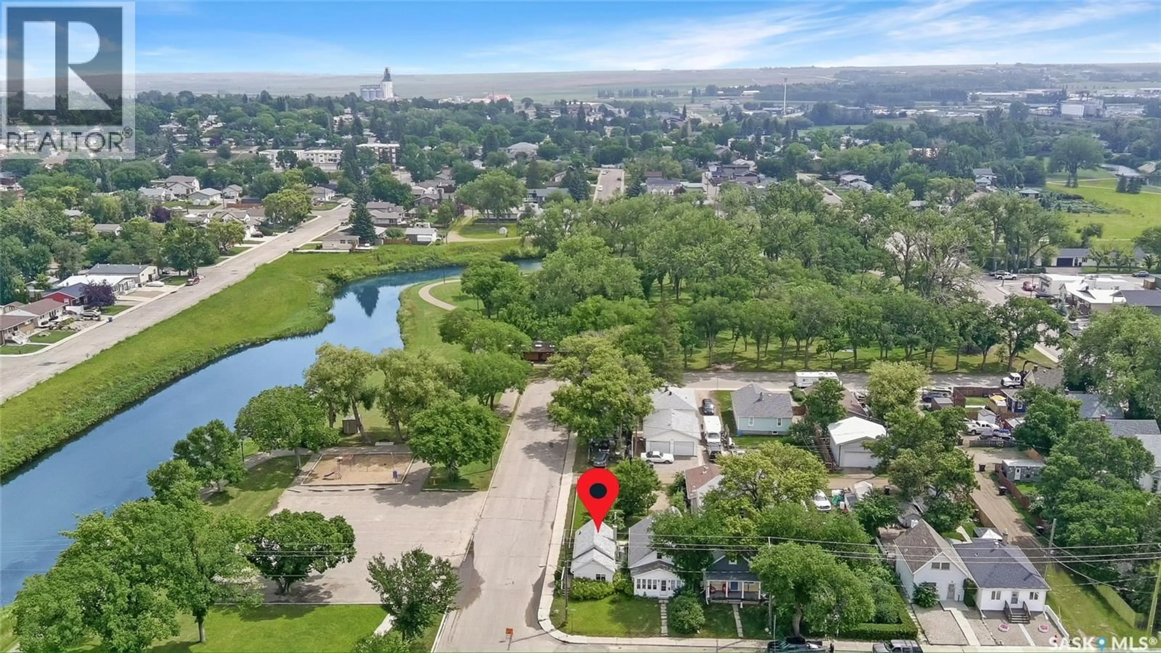 A pic from outside/outdoor area/front of a property/back of a property/a pic from drone, water/lake/river/ocean view for 245 8TH AVENUE, Swift Current Saskatchewan S9H2P5