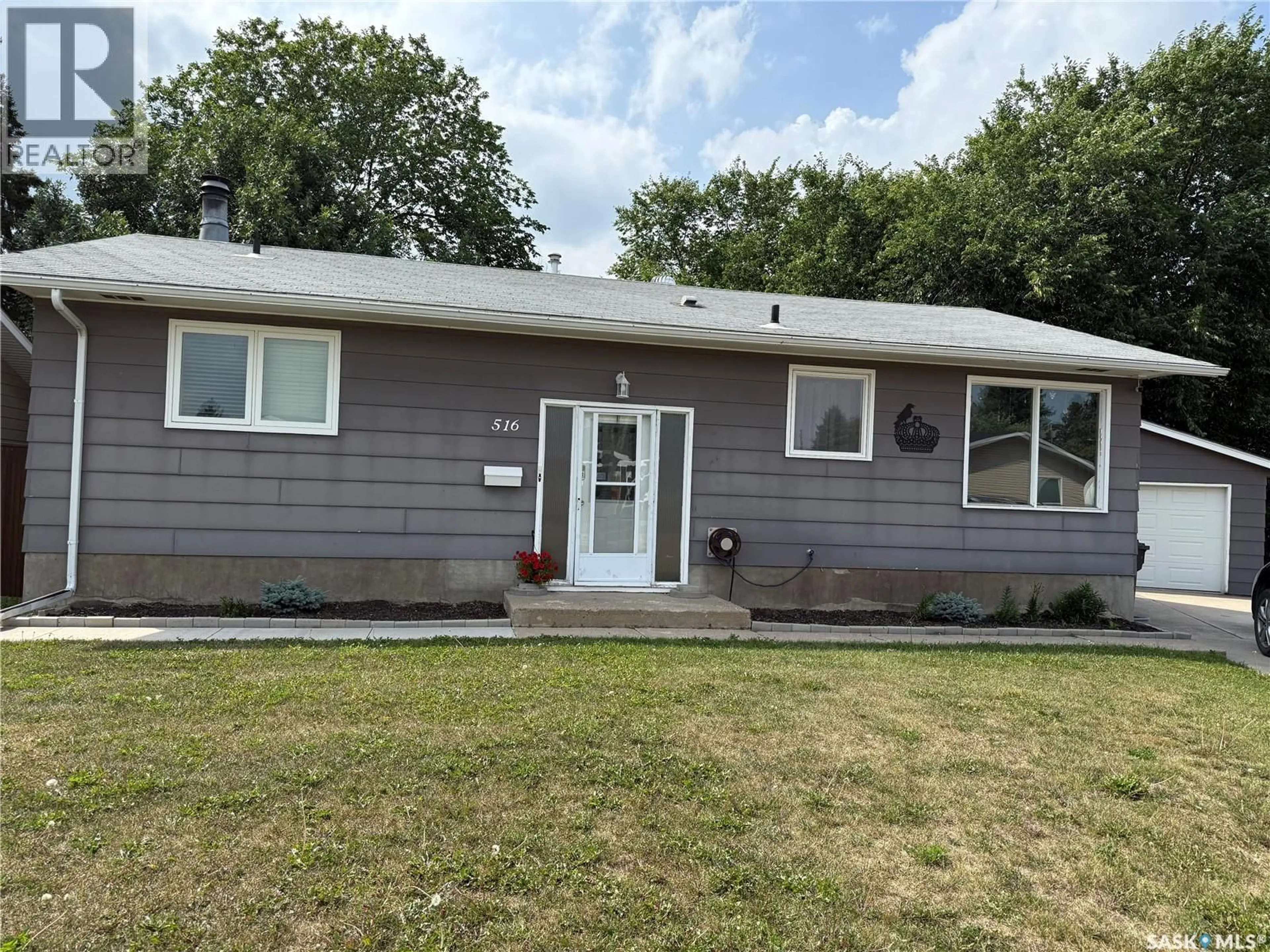 Home with vinyl exterior material, street for 516 CANAWINDRA COVE, Nipawin Saskatchewan S0E1E0