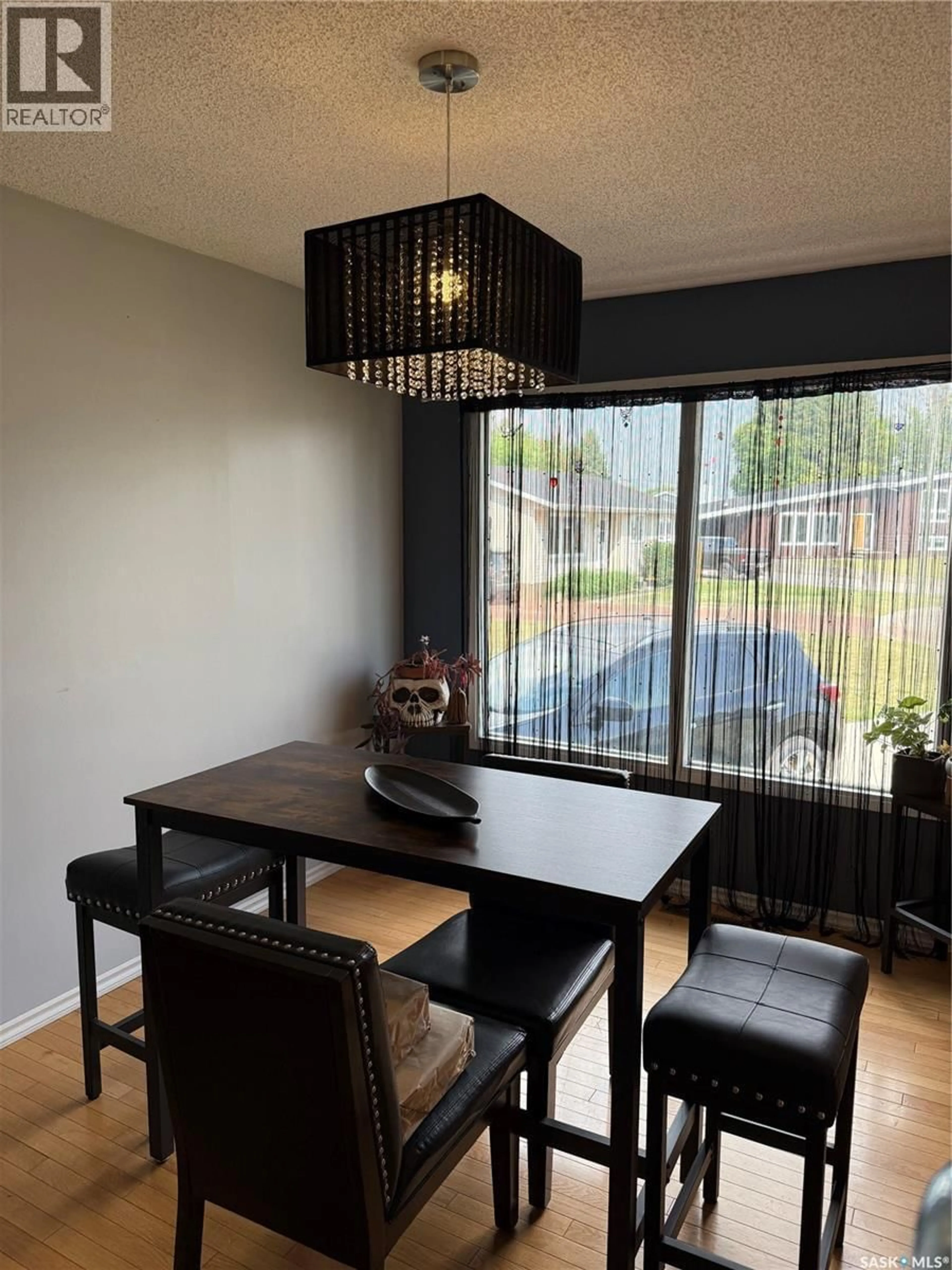 Dining room, wood/laminate floor for 516 CANAWINDRA COVE, Nipawin Saskatchewan S0E1E0