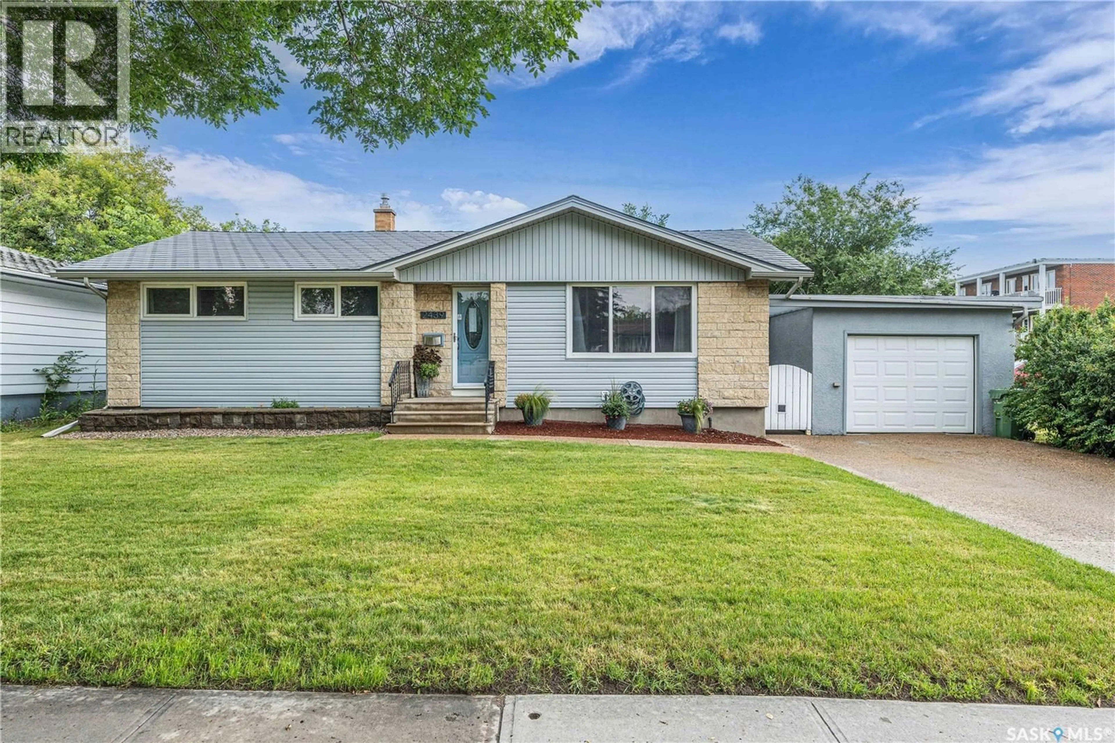 Home with vinyl exterior material, street for 2439 GORDON ROAD, Regina Saskatchewan S4S4M4
