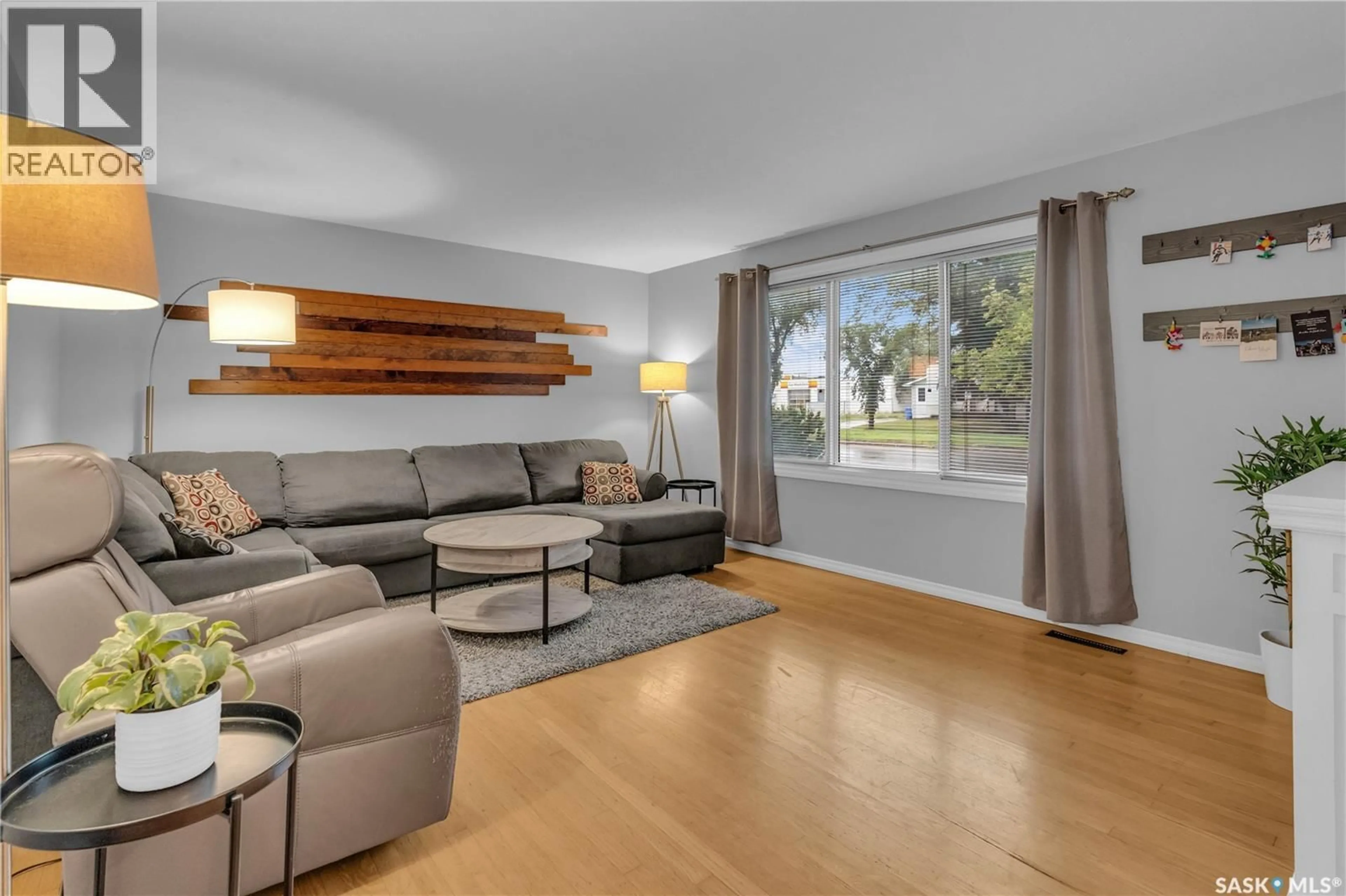 Living room with furniture, wood/laminate floor for 2439 GORDON ROAD, Regina Saskatchewan S4S4M4