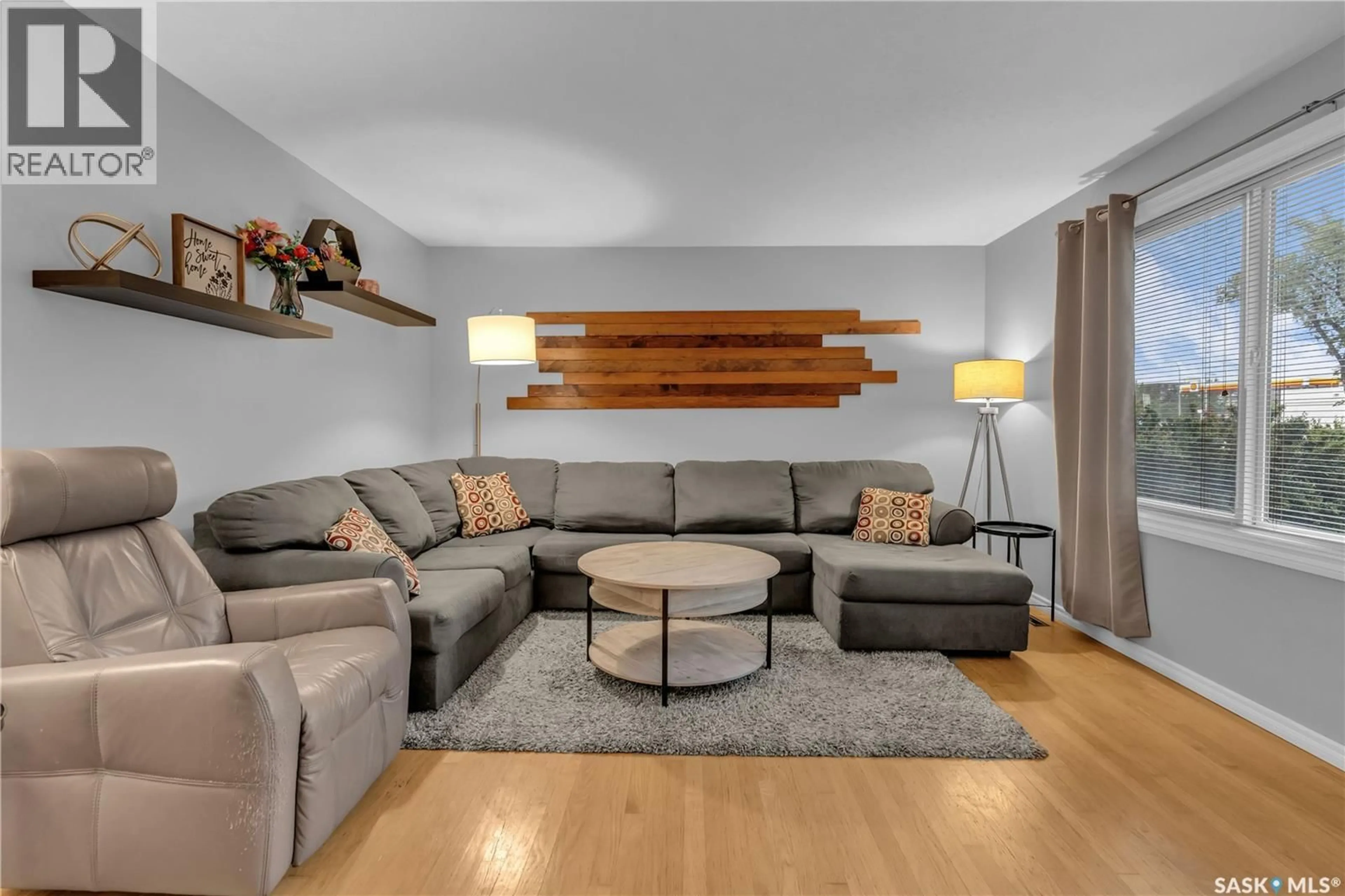 Living room with furniture, wood/laminate floor for 2439 GORDON ROAD, Regina Saskatchewan S4S4M4