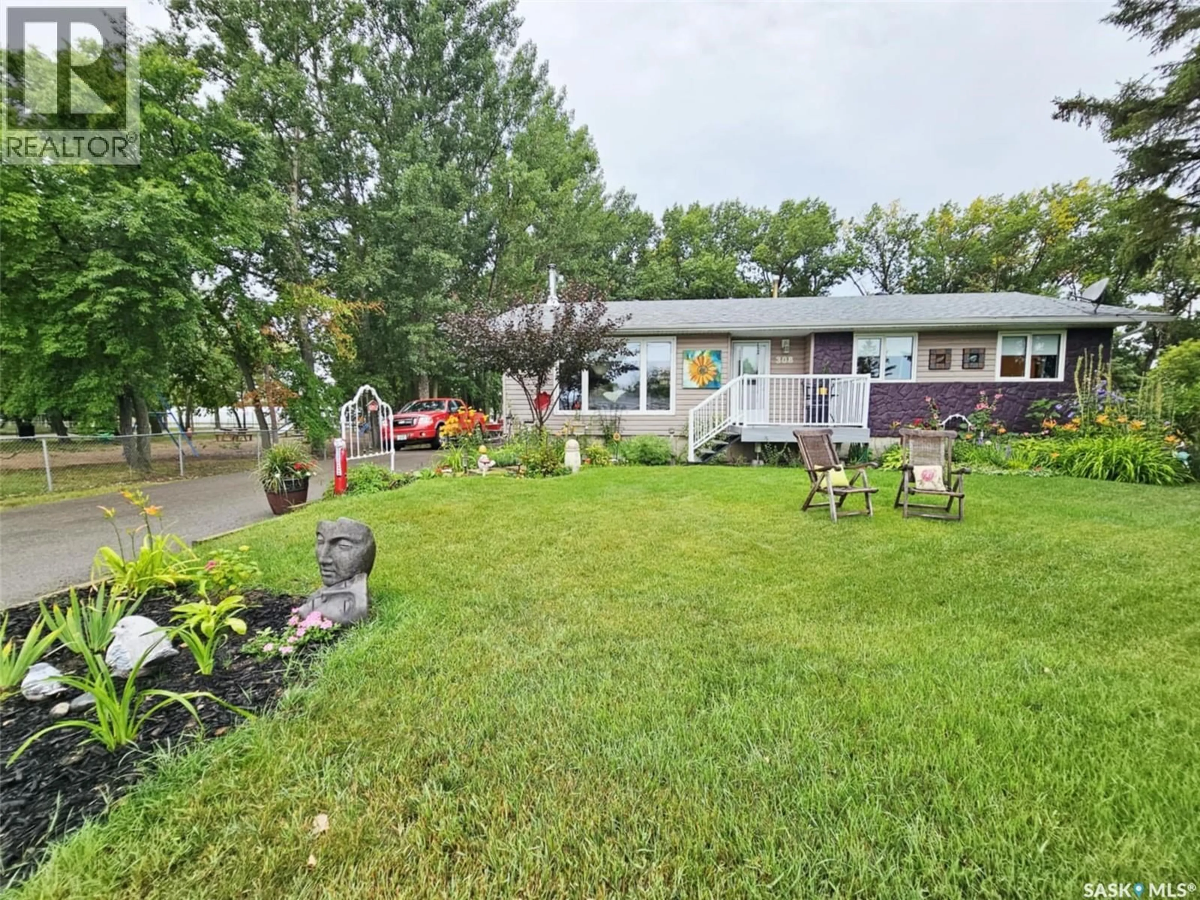 A pic from outside/outdoor area/front of a property/back of a property/a pic from drone, water/lake/river/ocean view for 308 LALONDE STREET, Whitewood Saskatchewan S0G5C0