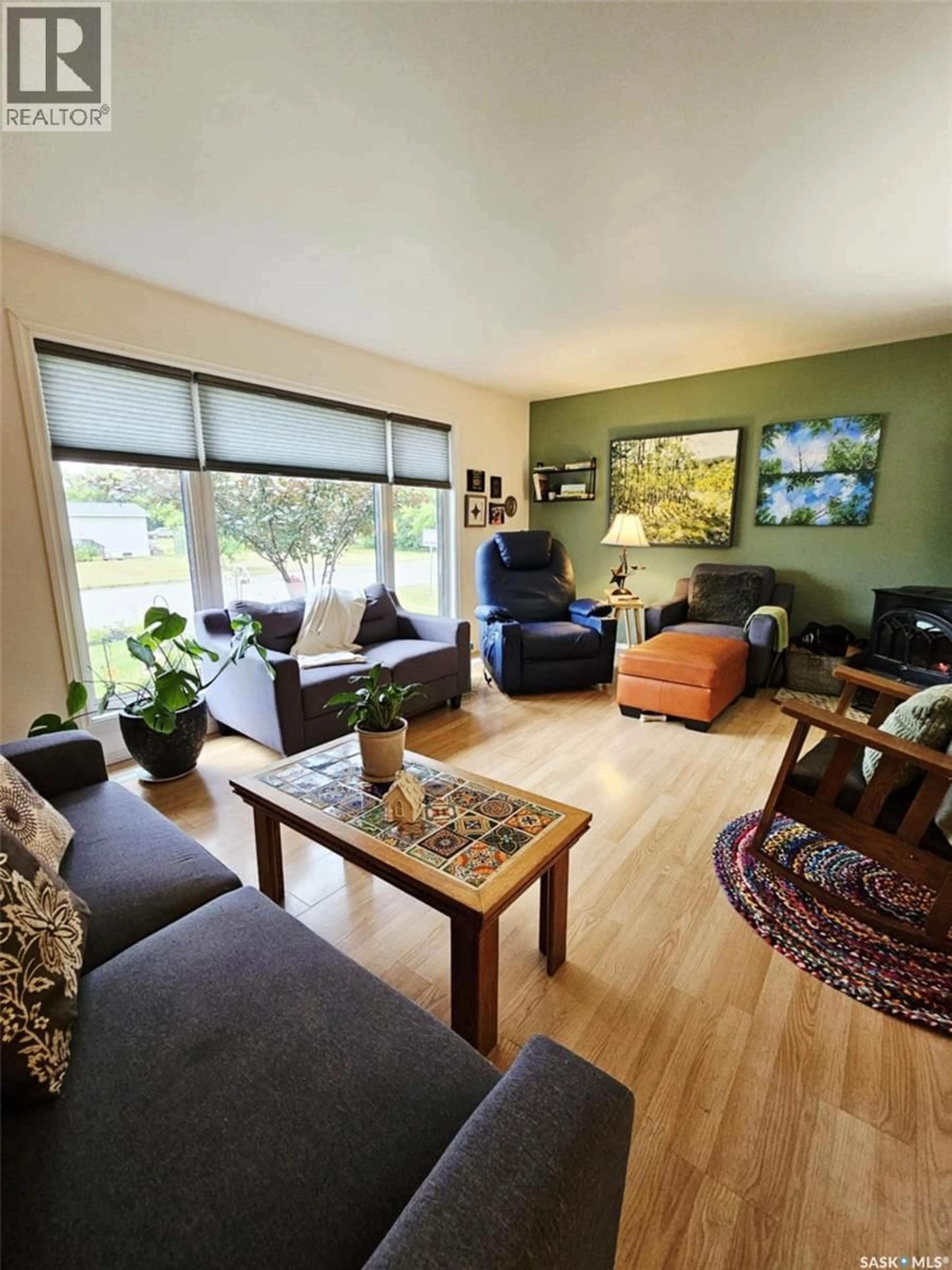 Living room with furniture, wood/laminate floor for 308 LALONDE STREET, Whitewood Saskatchewan S0G5C0