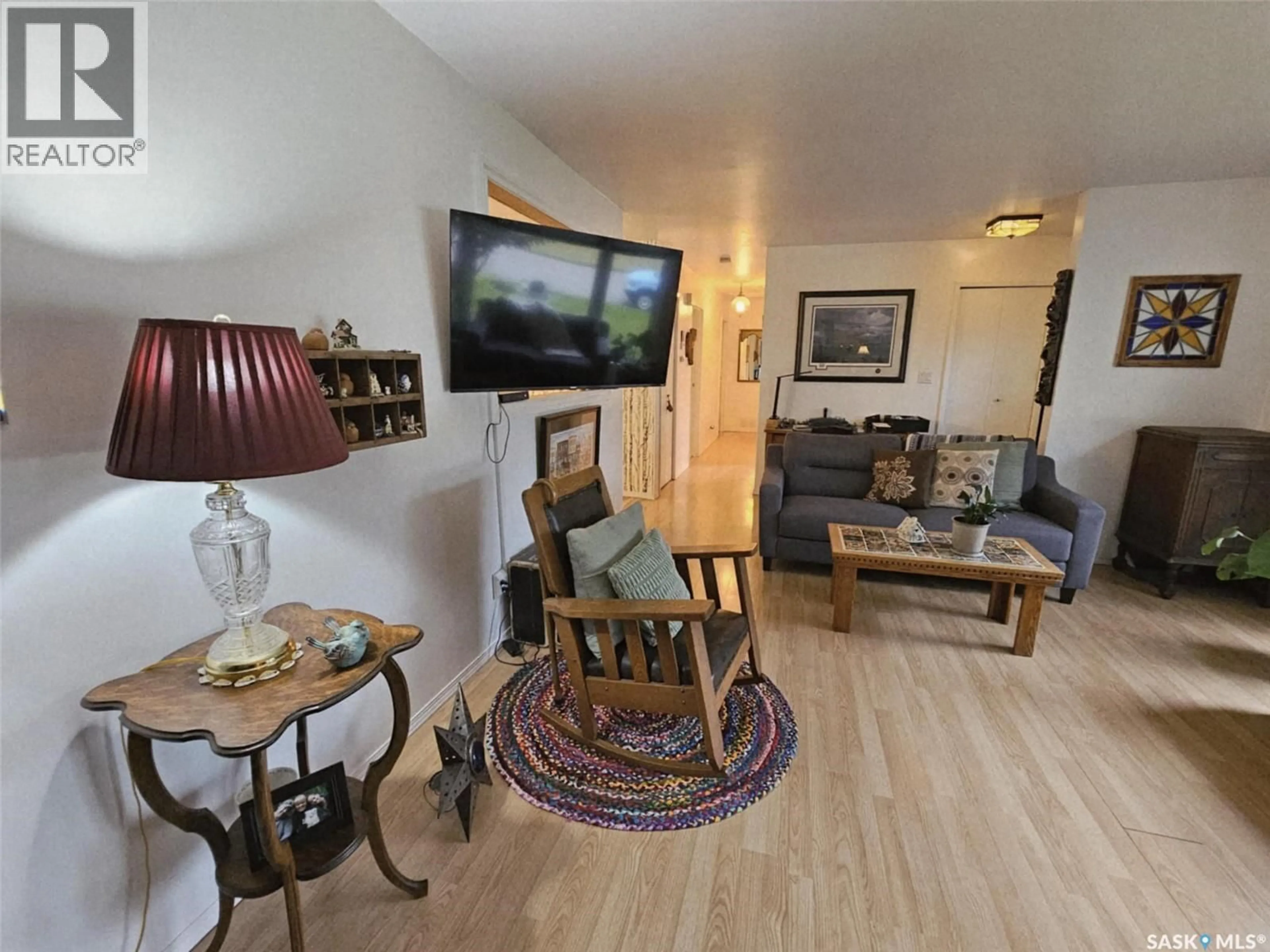 Living room with furniture, wood/laminate floor for 308 LALONDE STREET, Whitewood Saskatchewan S0G5C0