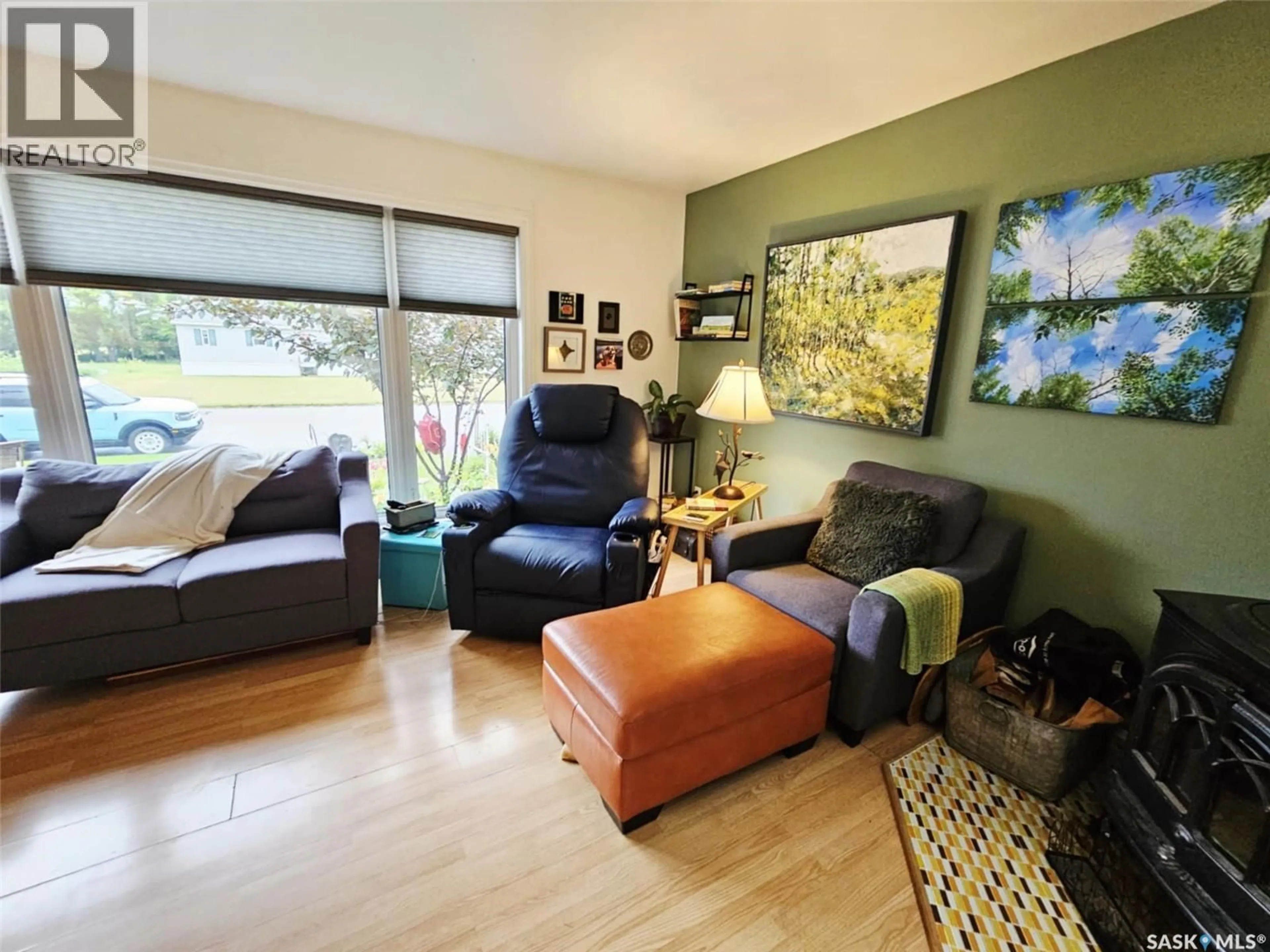 Living room with furniture, wood/laminate floor for 308 LALONDE STREET, Whitewood Saskatchewan S0G5C0