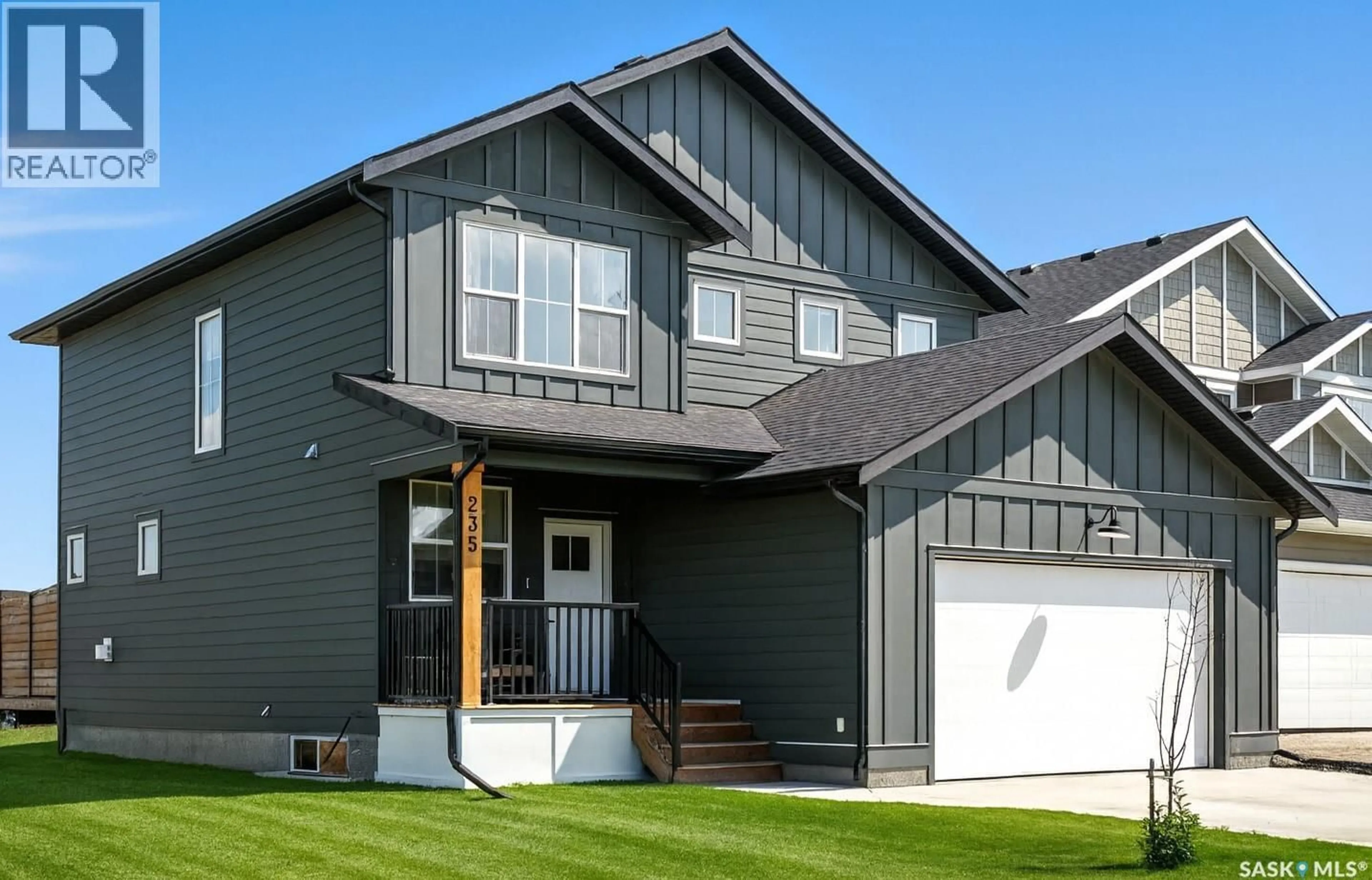 Home with vinyl exterior material, street for 235 DZIADYK MANOR, Saskatoon Saskatchewan S7V1M5