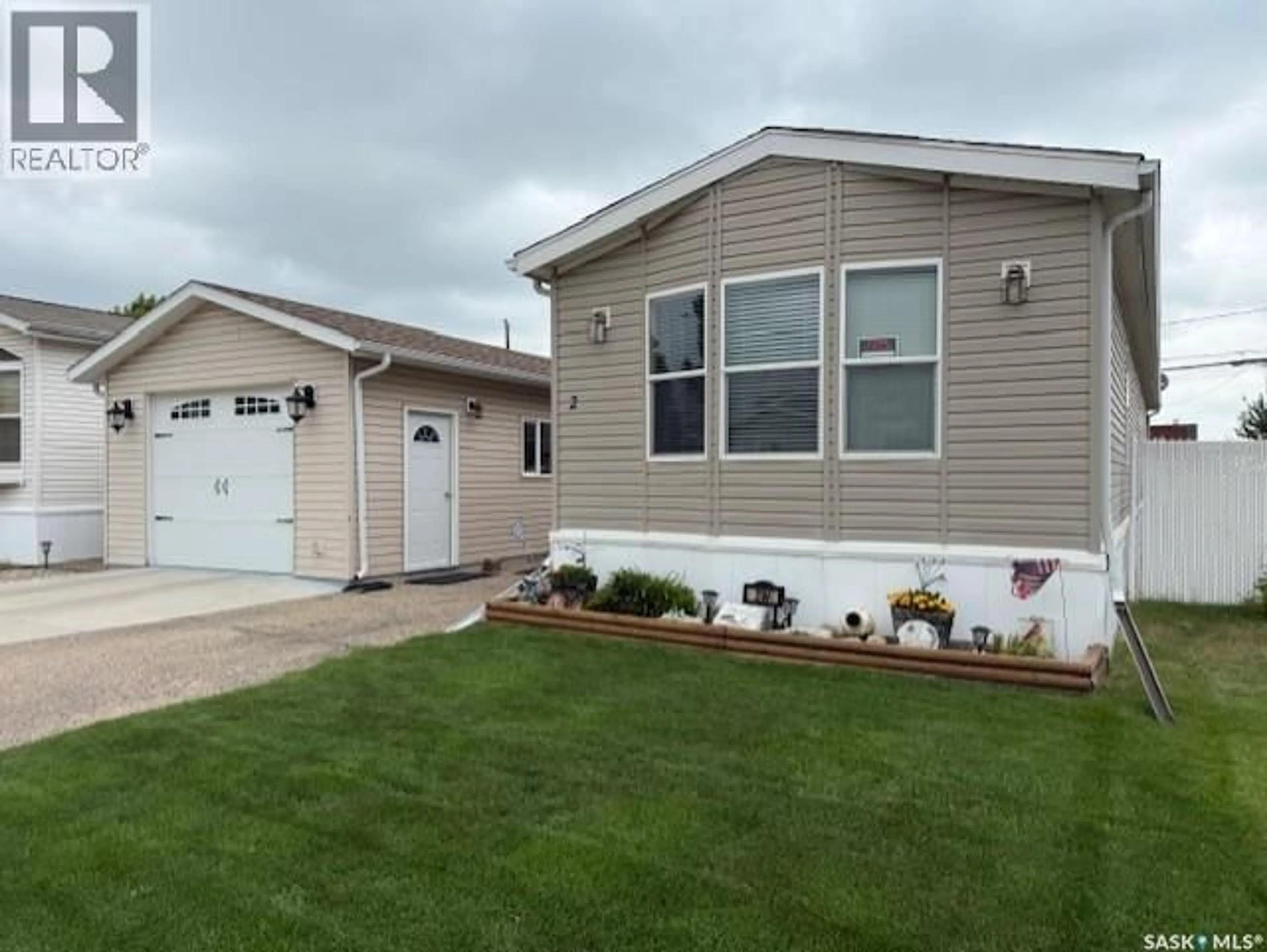 Home with vinyl exterior material, street for 2 555 DIELSCHNEIDER ROAD, Melville Saskatchewan S0A2P0