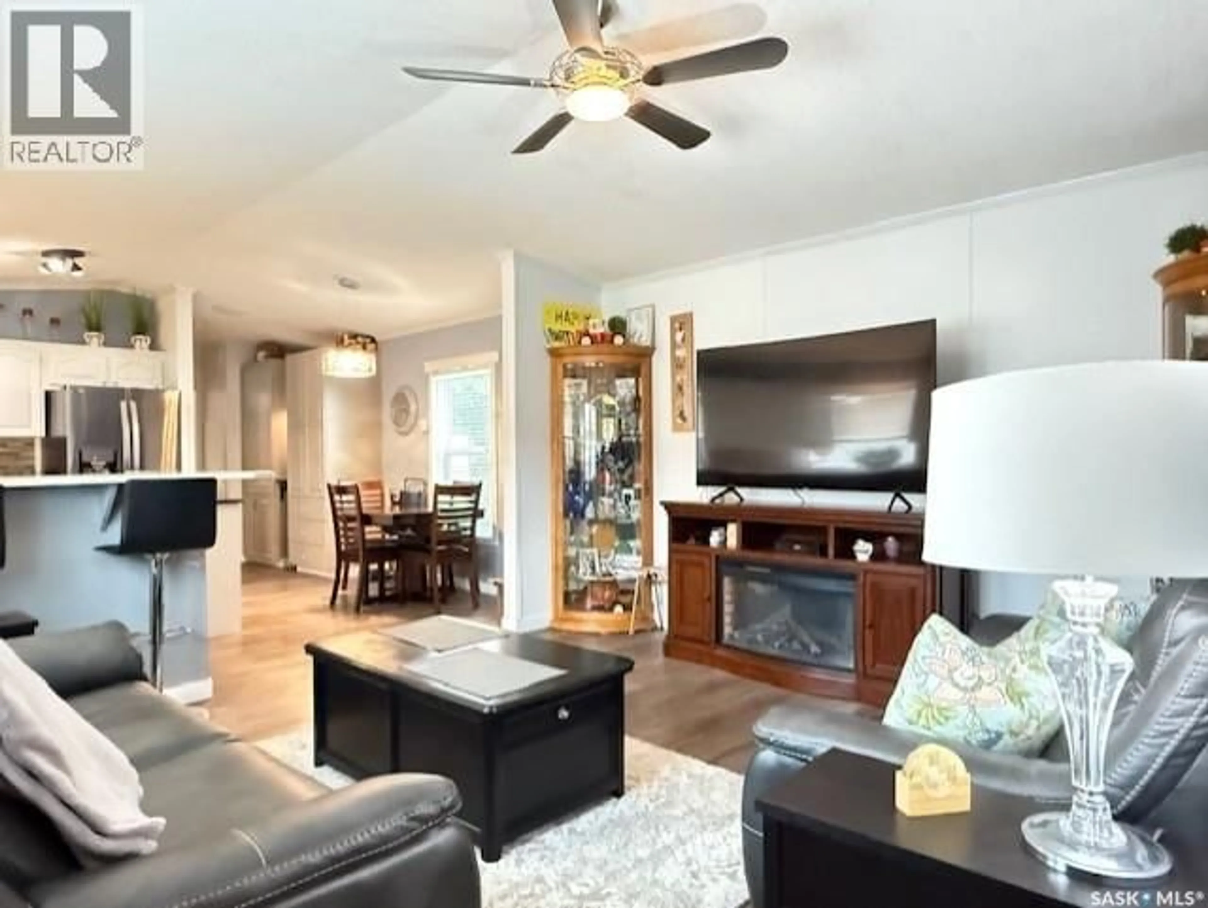 Living room with furniture, wood/laminate floor for 2 555 DIELSCHNEIDER ROAD, Melville Saskatchewan S0A2P0