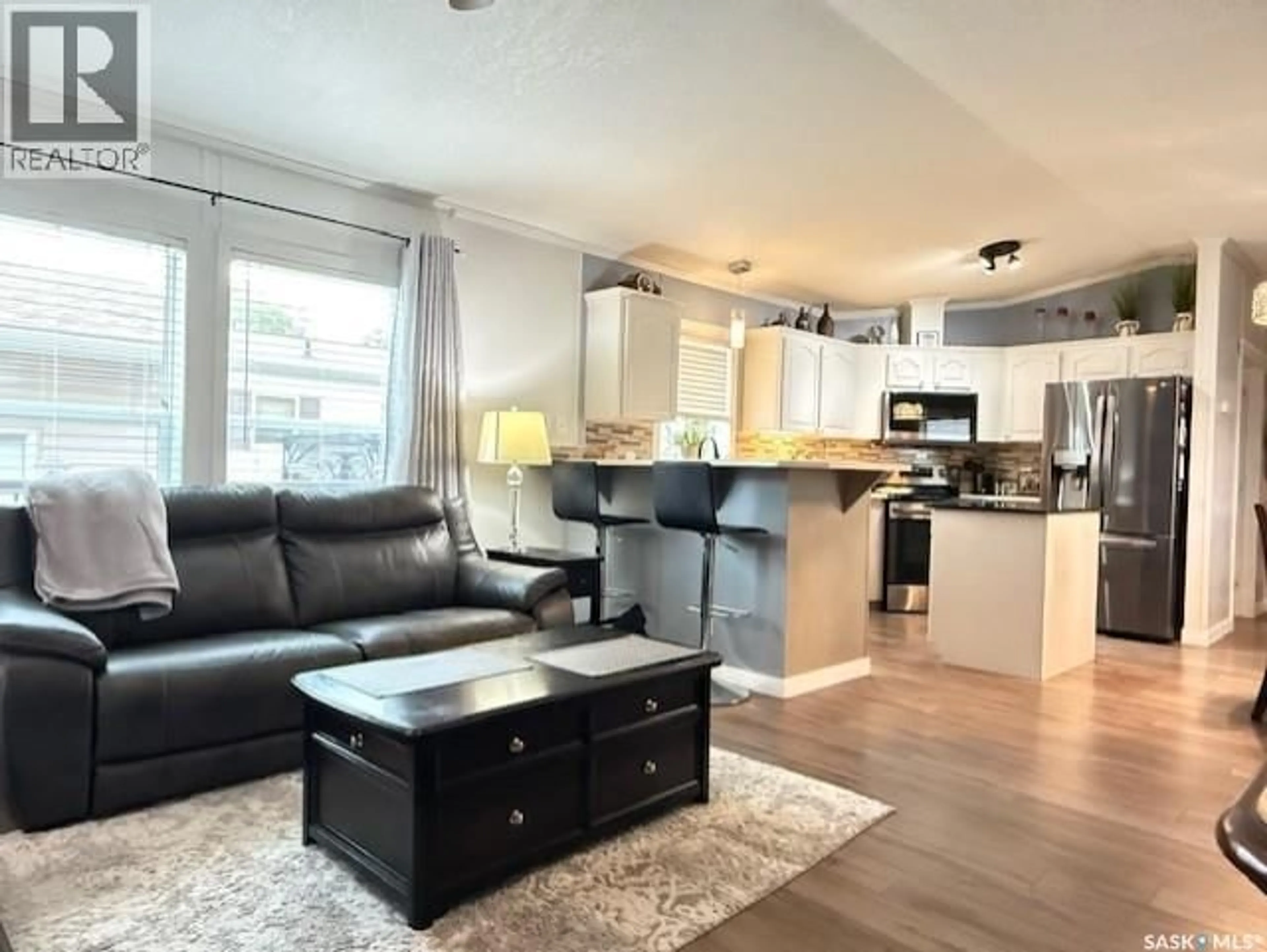 Living room with furniture, wood/laminate floor for 2 555 DIELSCHNEIDER ROAD, Melville Saskatchewan S0A2P0