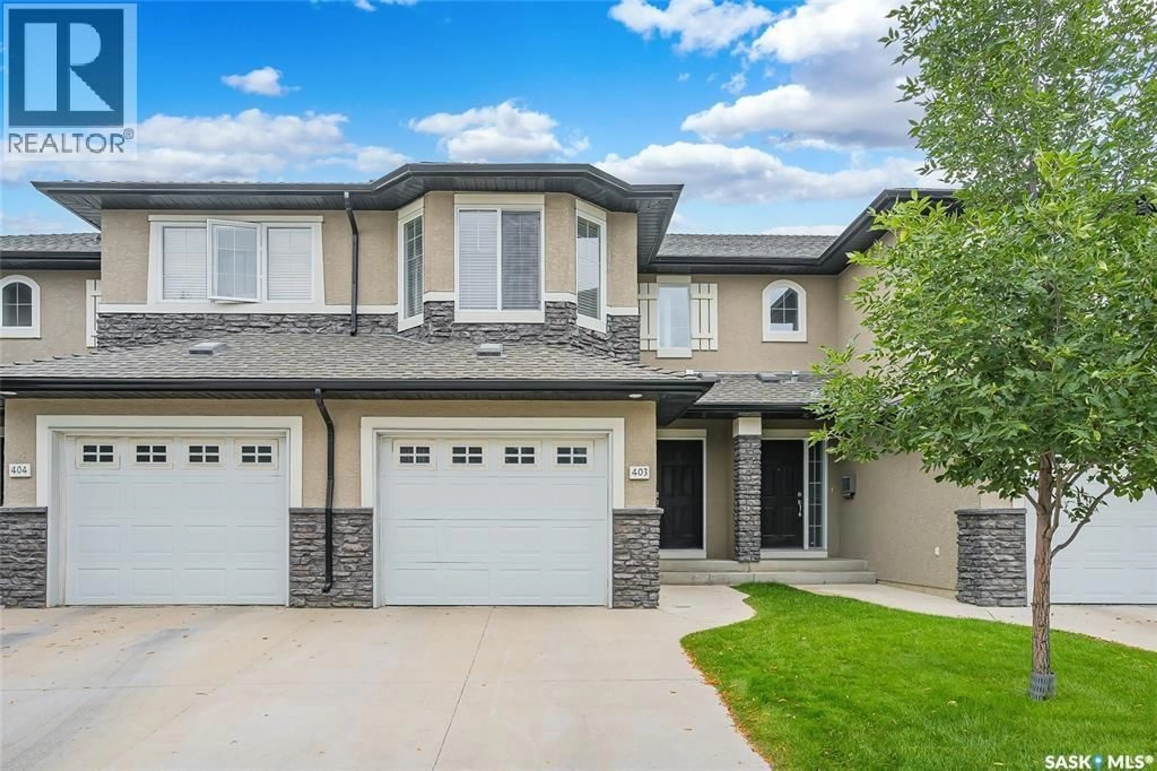 Home with vinyl exterior material, street for 410 - 403 HUNTER ROAD, Saskatoon Saskatchewan S7T0L5