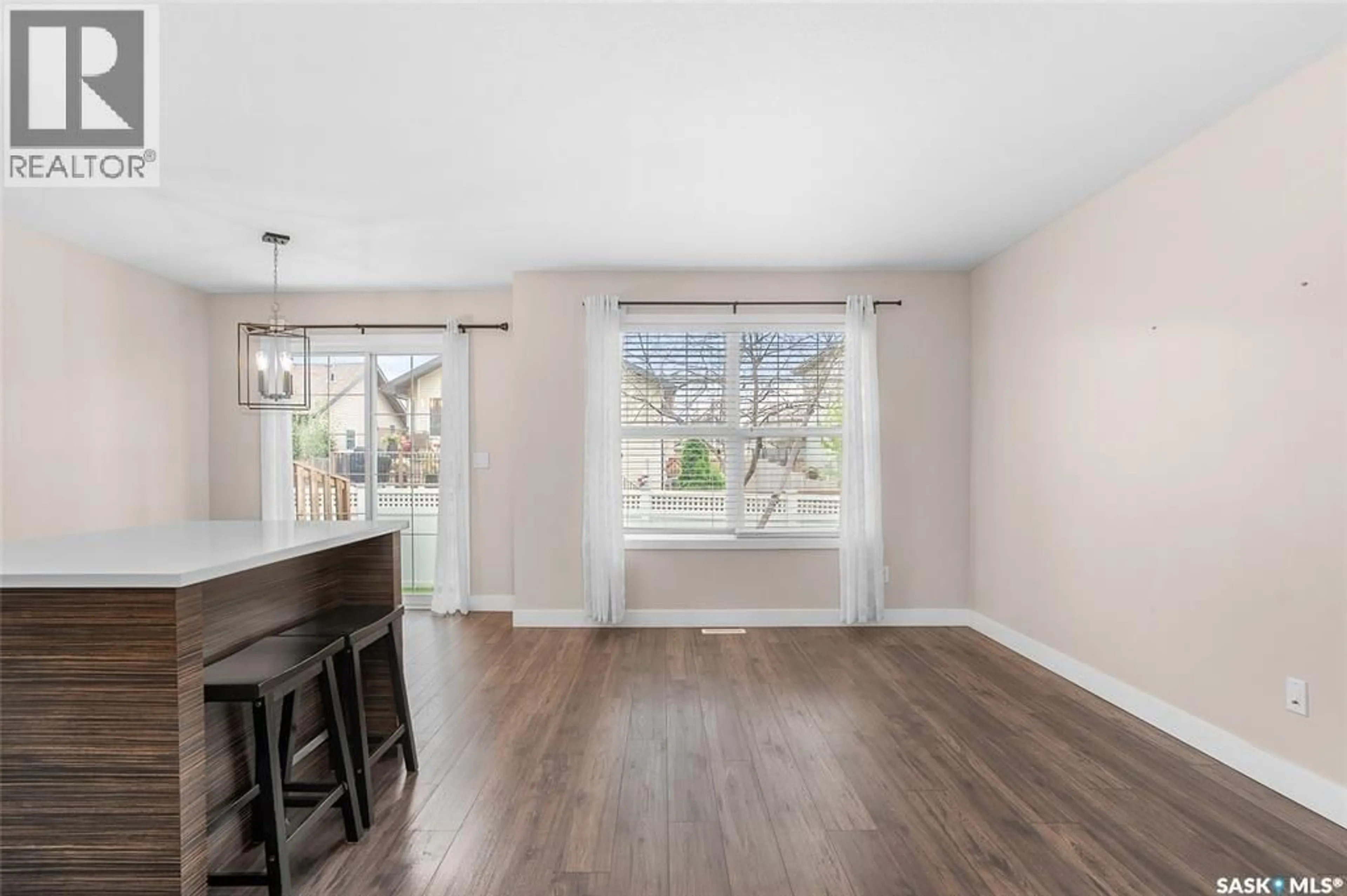 Open concept kitchen, wood/laminate floor for 410 - 403 HUNTER ROAD, Saskatoon Saskatchewan S7T0L5