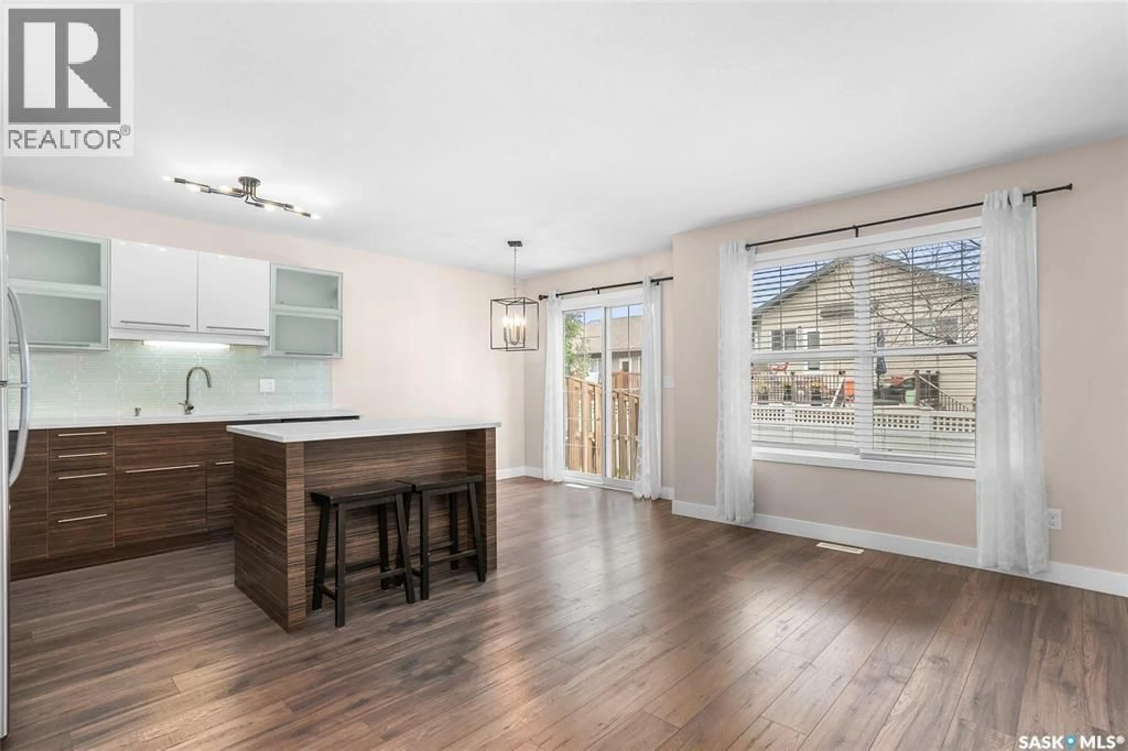 Open concept kitchen, wood/laminate floor for 410 - 403 HUNTER ROAD, Saskatoon Saskatchewan S7T0L5