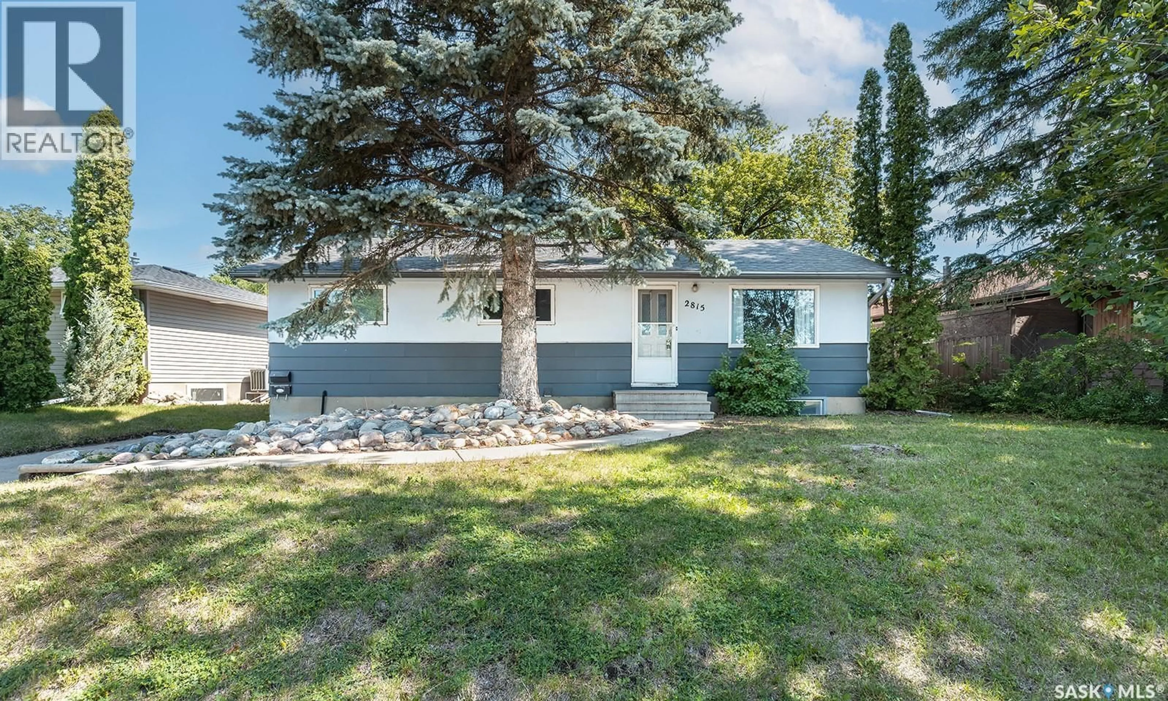 Home with vinyl exterior material, street for 2815 MCCONNELL AVENUE, Saskatoon Saskatchewan S7J0W4