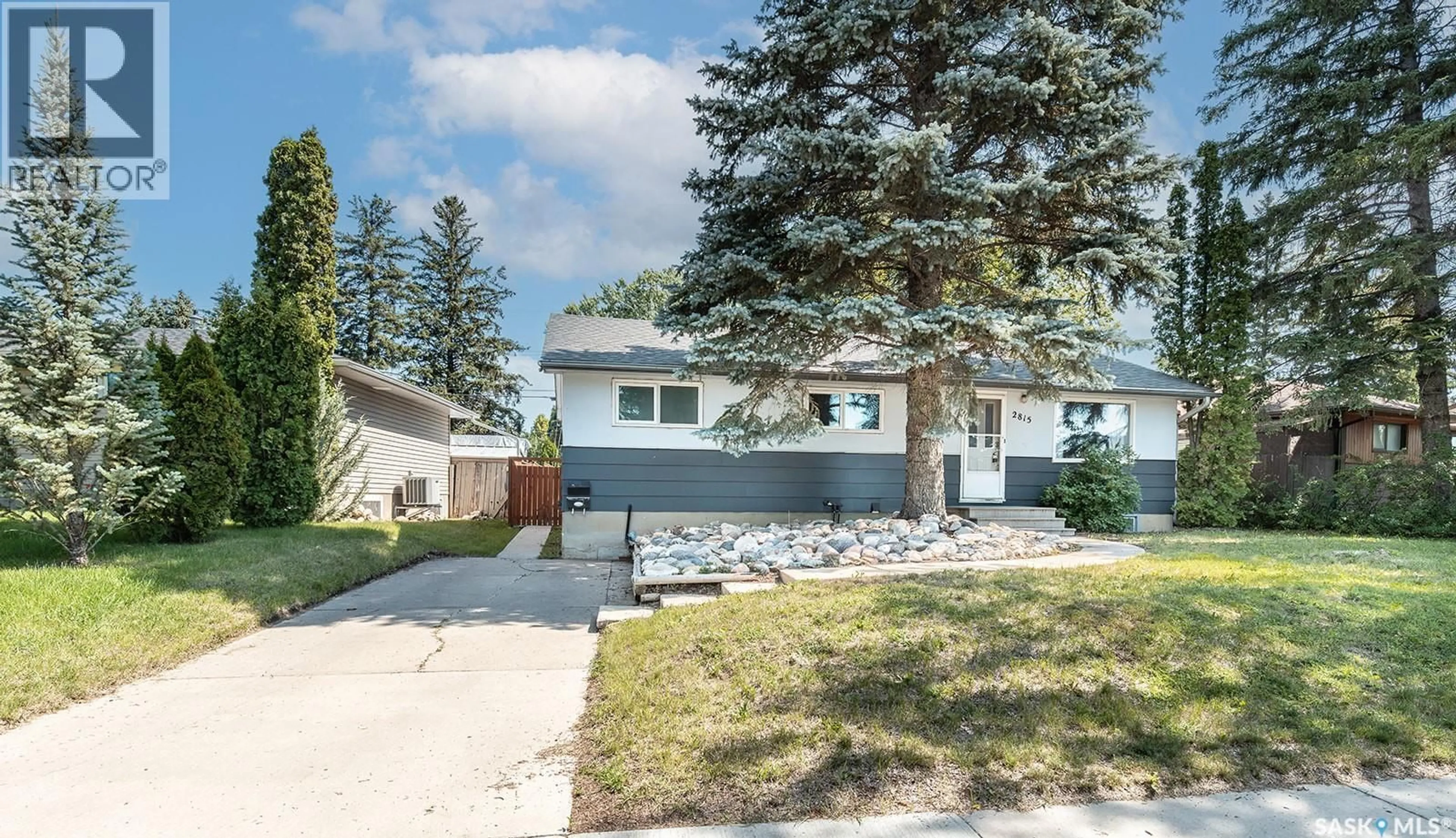 Home with vinyl exterior material, street for 2815 MCCONNELL AVENUE, Saskatoon Saskatchewan S7J0W4