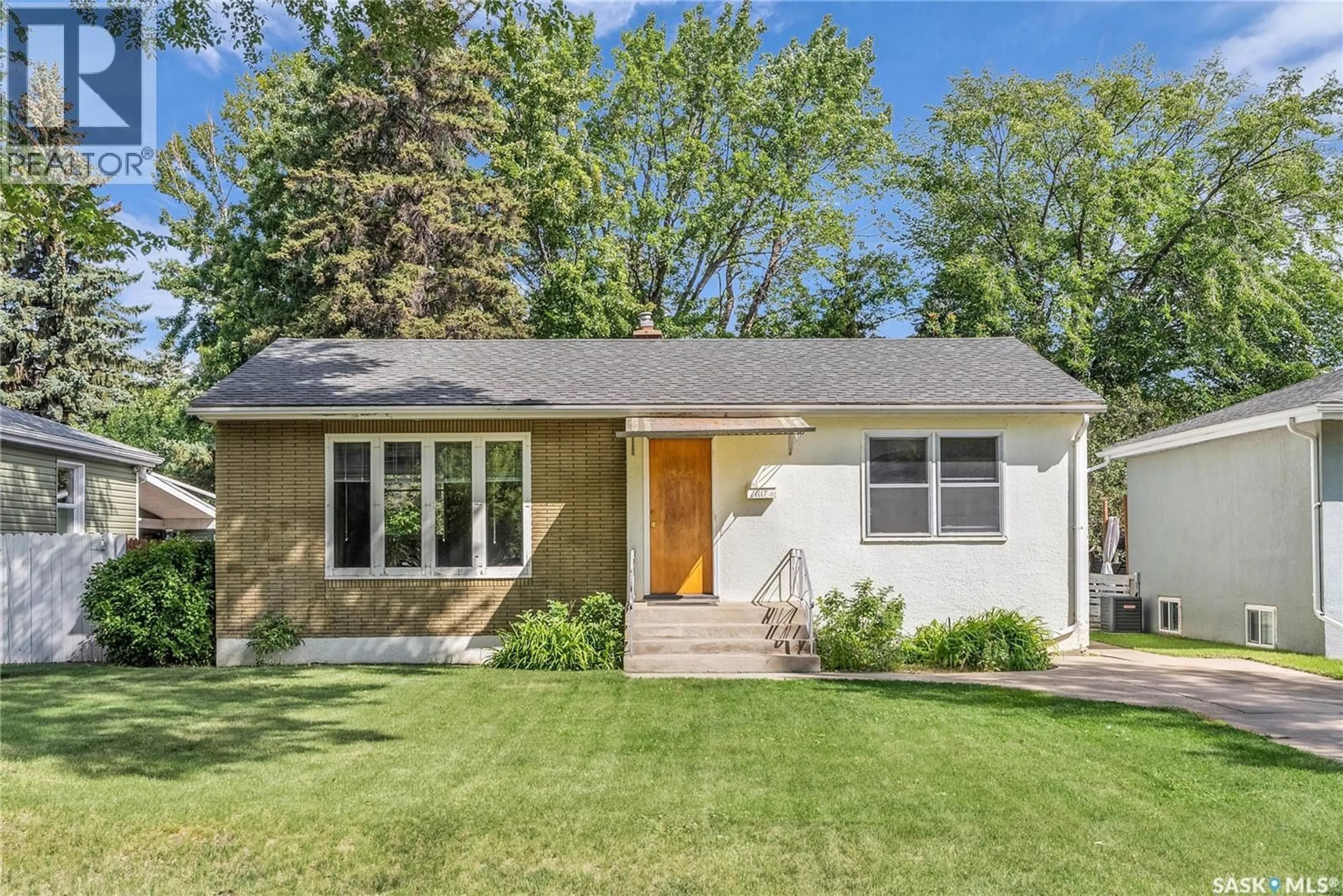 Home with vinyl exterior material, street for 1117 3RD STREET, Saskatoon Saskatchewan S7H1N1