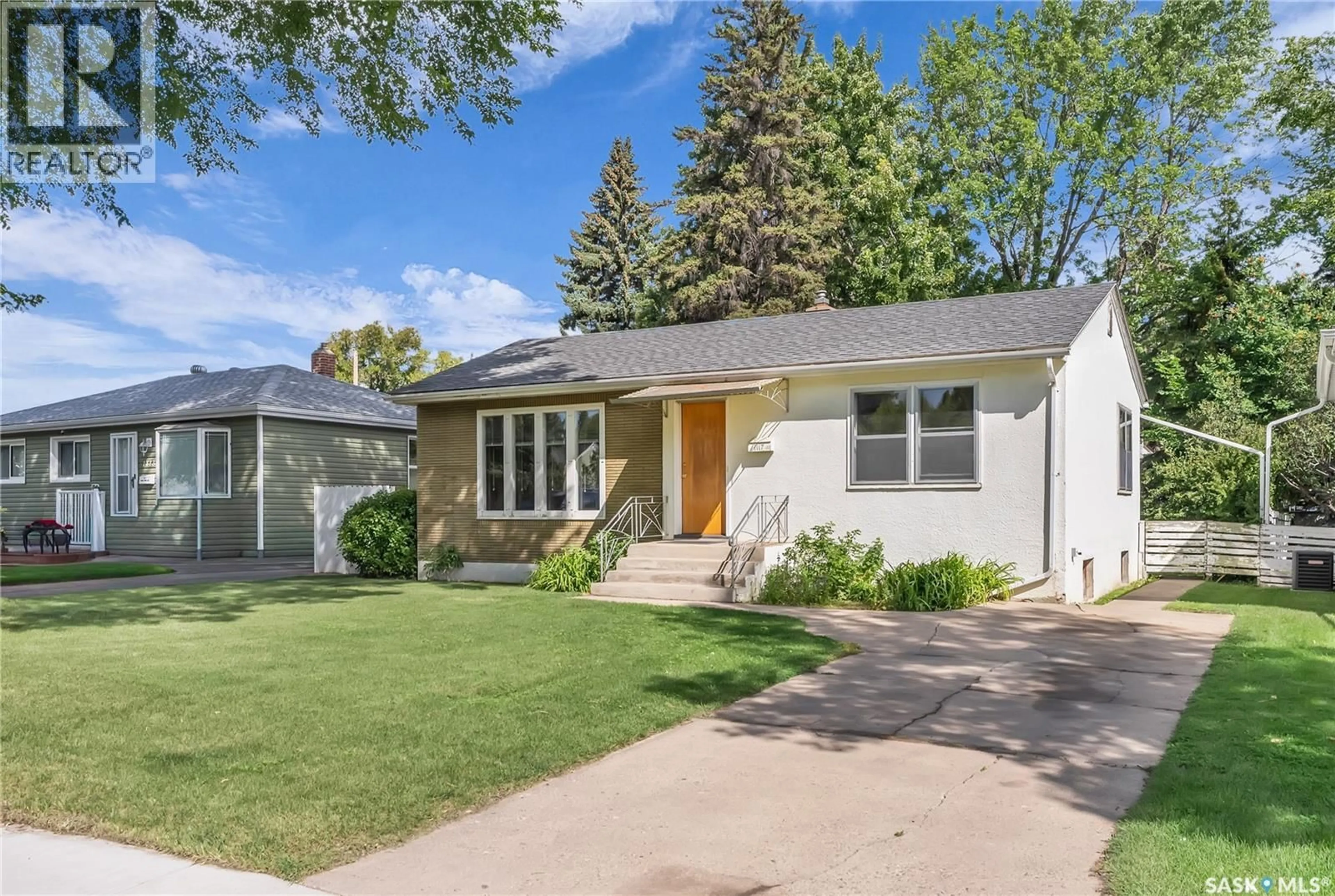 Home with vinyl exterior material, street for 1117 3RD STREET, Saskatoon Saskatchewan S7H1N1
