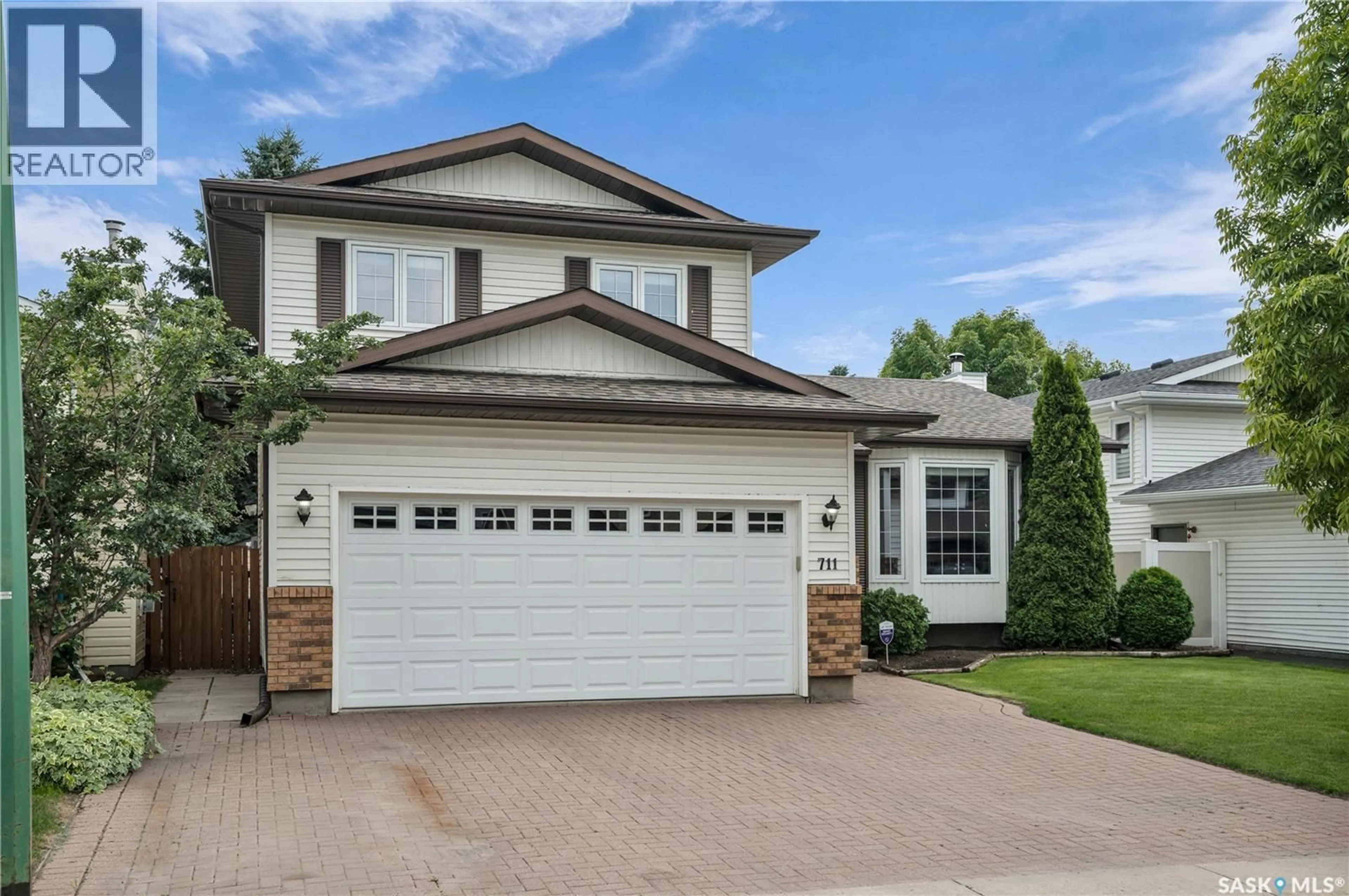 Home with brick exterior material, street for 711 SWAN CRESCENT, Saskatoon Saskatchewan S7J5C3