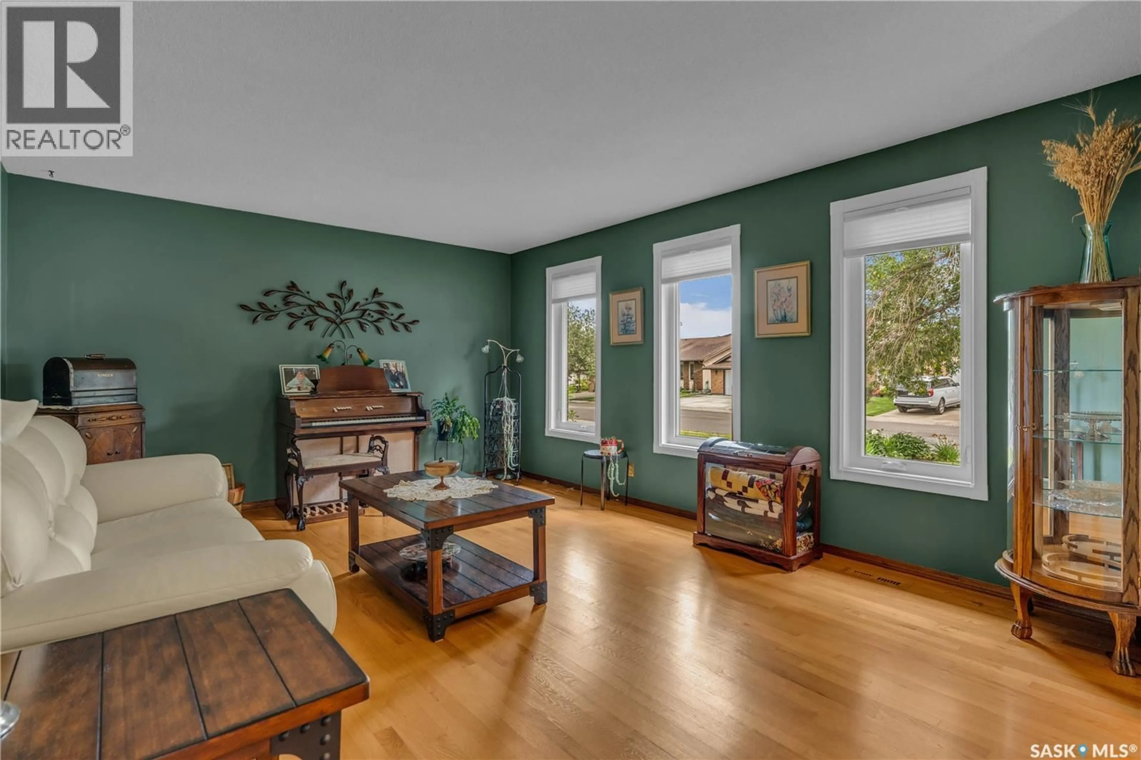 Living room with furniture, wood/laminate floor for 2310 GOLDMAN CRESCENT, Regina Saskatchewan S4V1E4