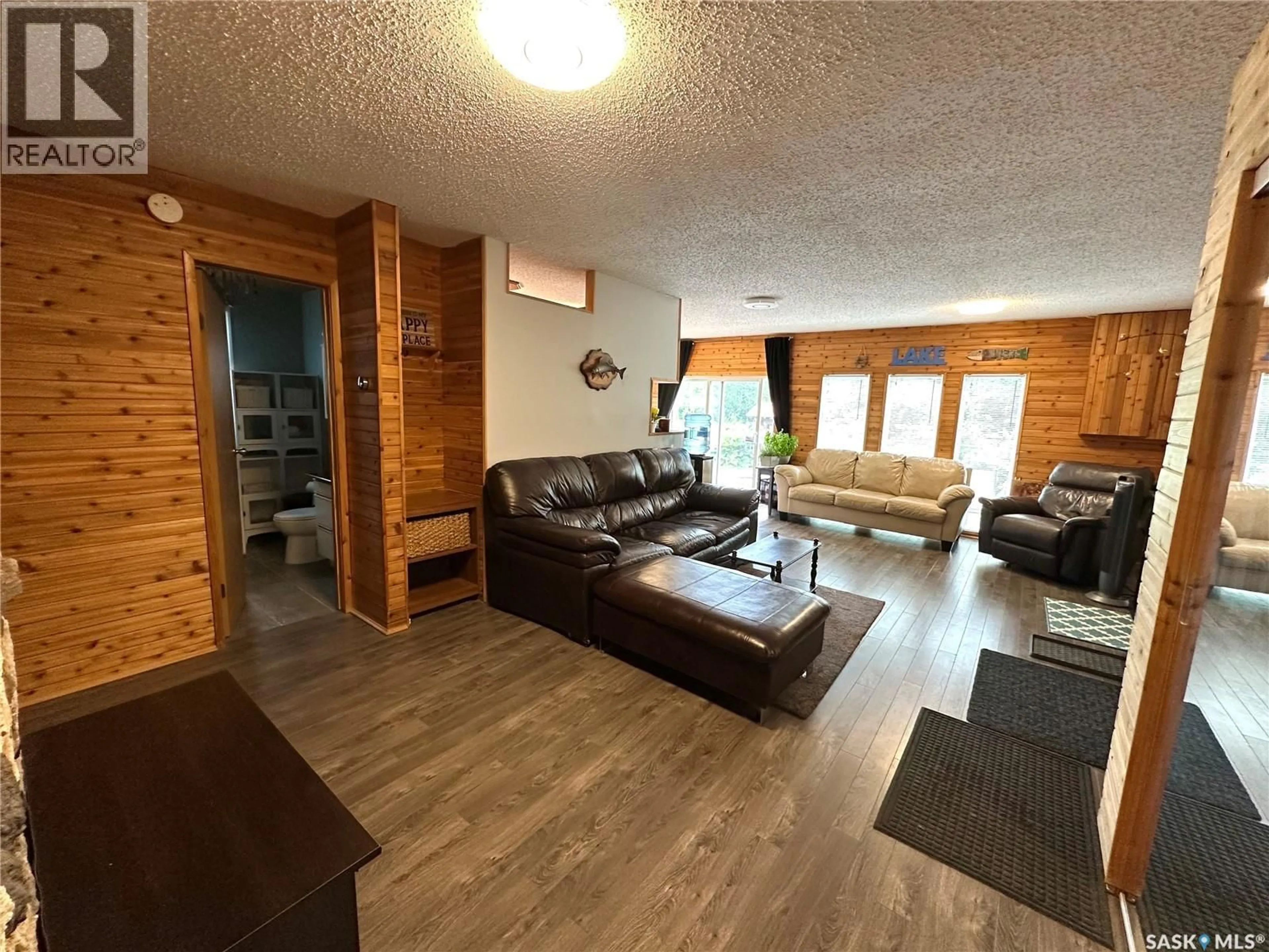 Living room with furniture, wood/laminate floor for 213 LAKEVIEW AVENUE, Canwood Rm No. 494 Saskatchewan S0J2X0
