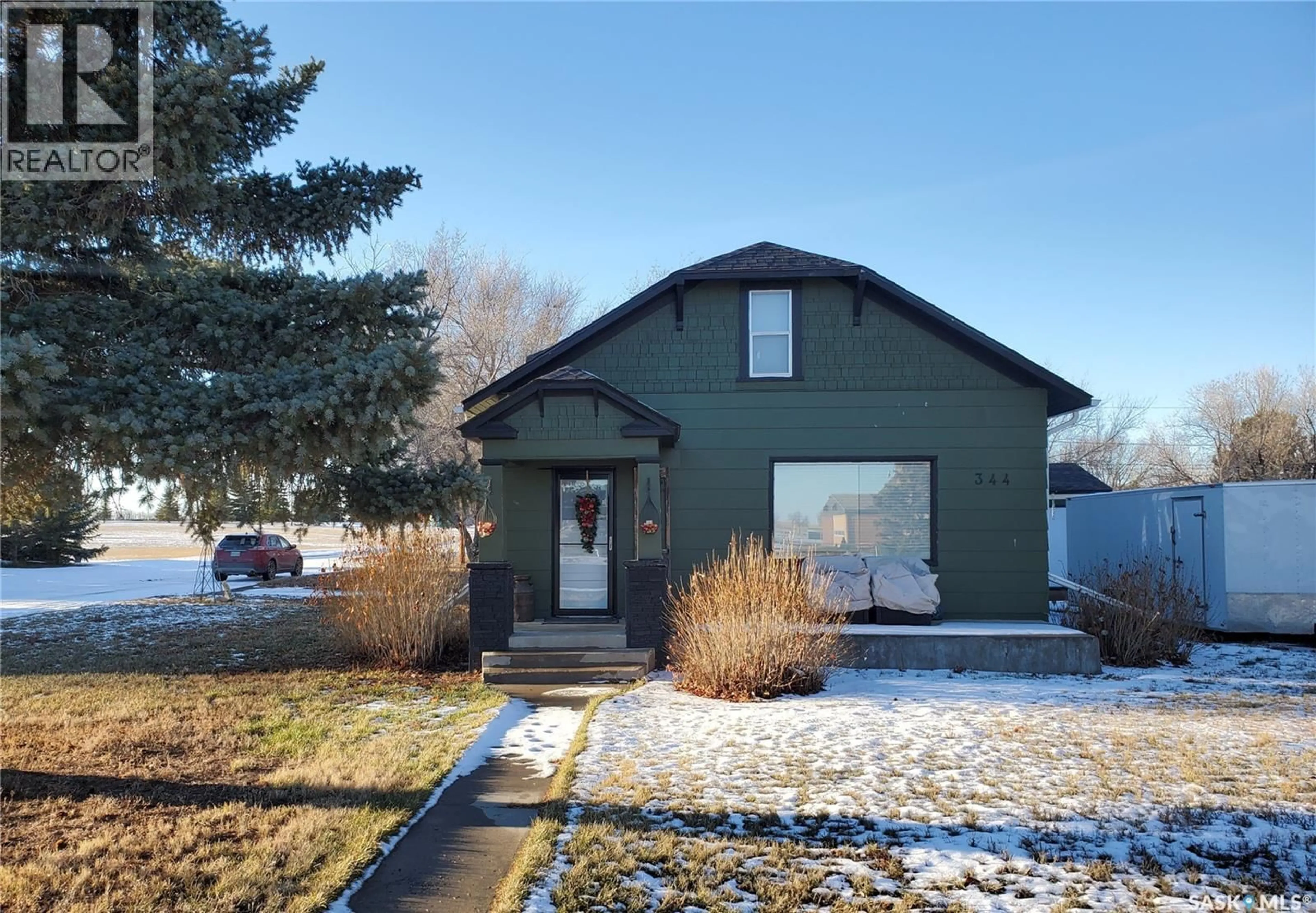 Home with vinyl exterior material, street for 344 CENTRE STREET, Ponteix Saskatchewan S0N1Z0