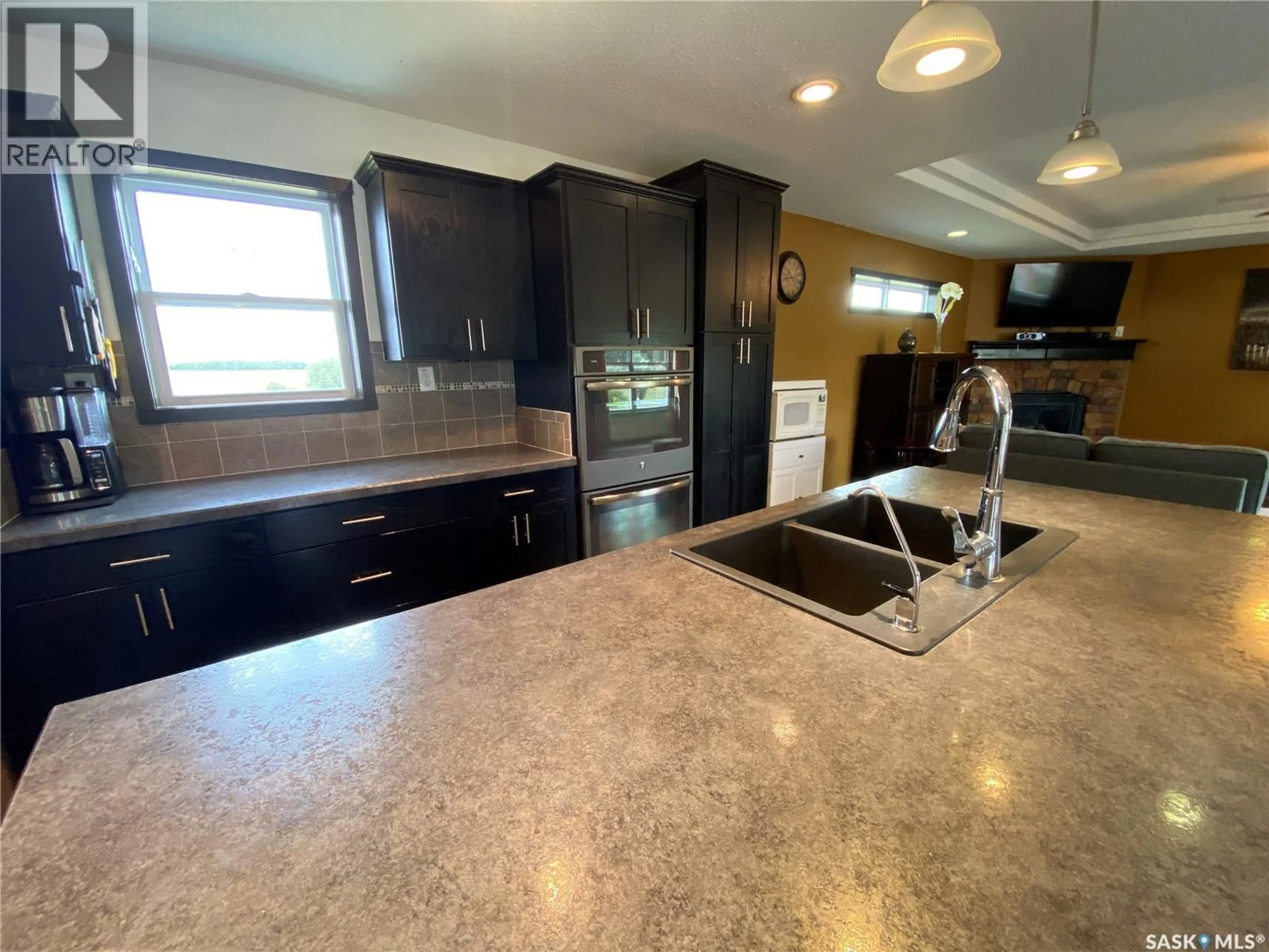 Open concept kitchen, ceramic/tile floor for ACREAGE, Orkney Rm No. 244 Saskatchewan S0A0T0