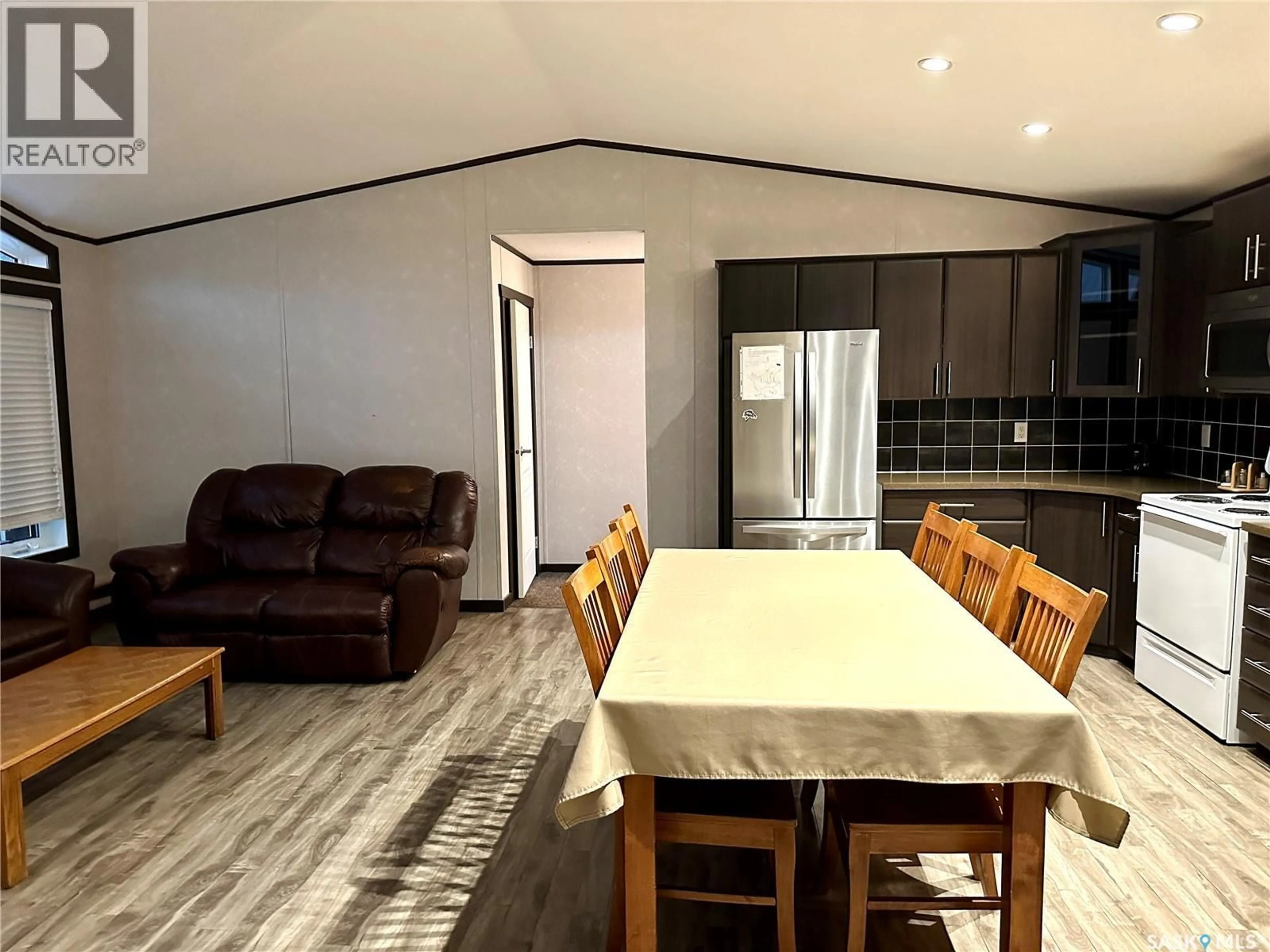 Dining room, wood/laminate floor for 903 OTTER STREET, Missinipe Saskatchewan S0J1L0