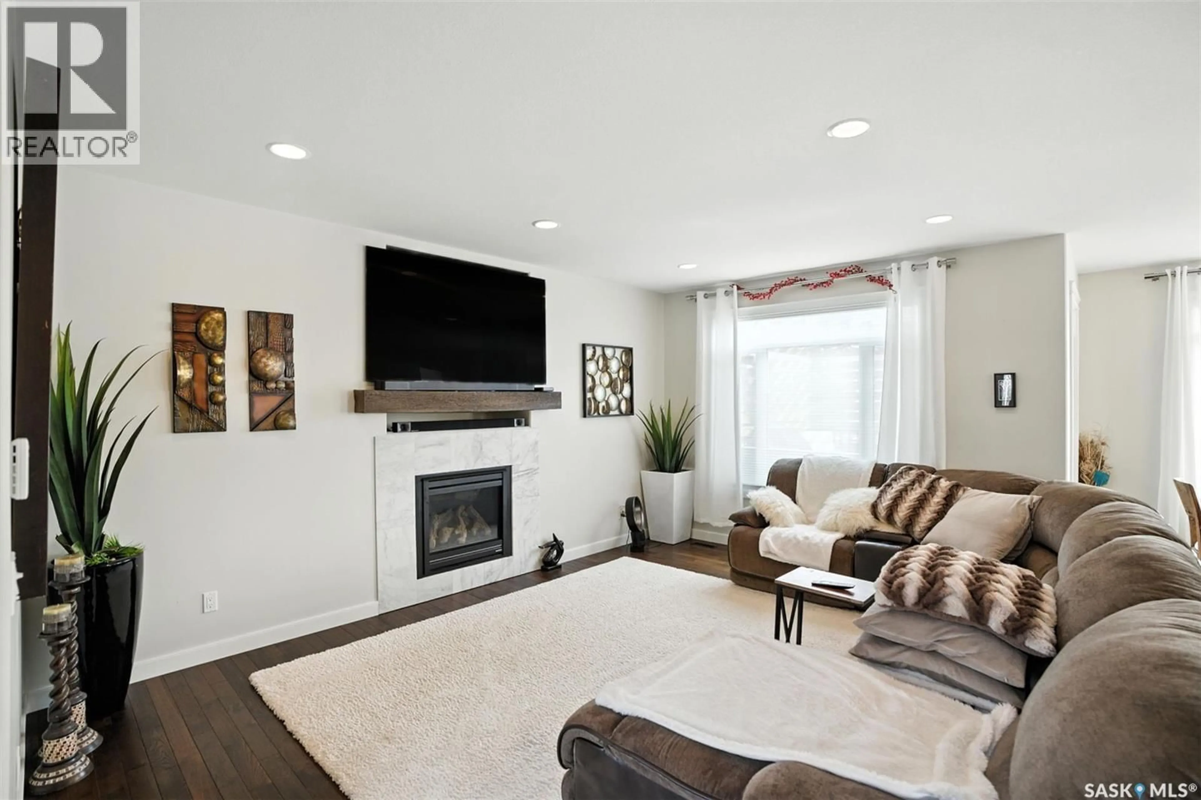 Living room with furniture, unknown for 611 REDWOOD CRESCENT, Warman Saskatchewan S0K0A1