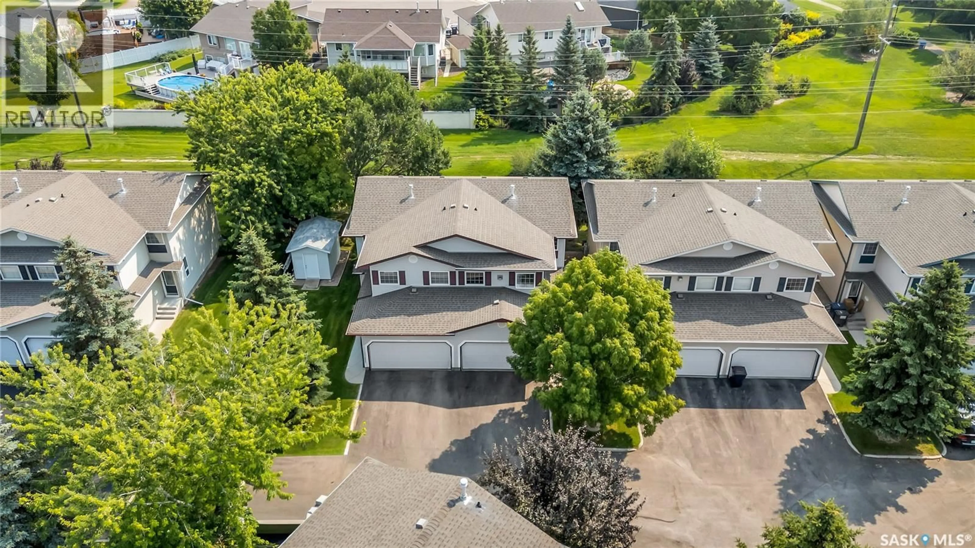 A pic from outside/outdoor area/front of a property/back of a property/a pic from drone, street for 615 - 208 KENDERDINE ROAD, Saskatoon Saskatchewan S7N4V1