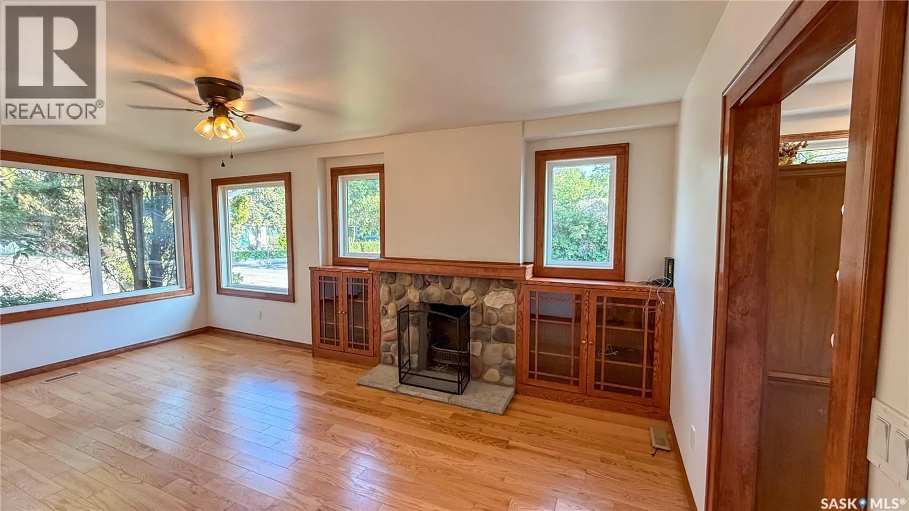 Living room with furniture, wood/laminate floor for 1378 MCTAVISH STREET, Regina Saskatchewan S4T3V9