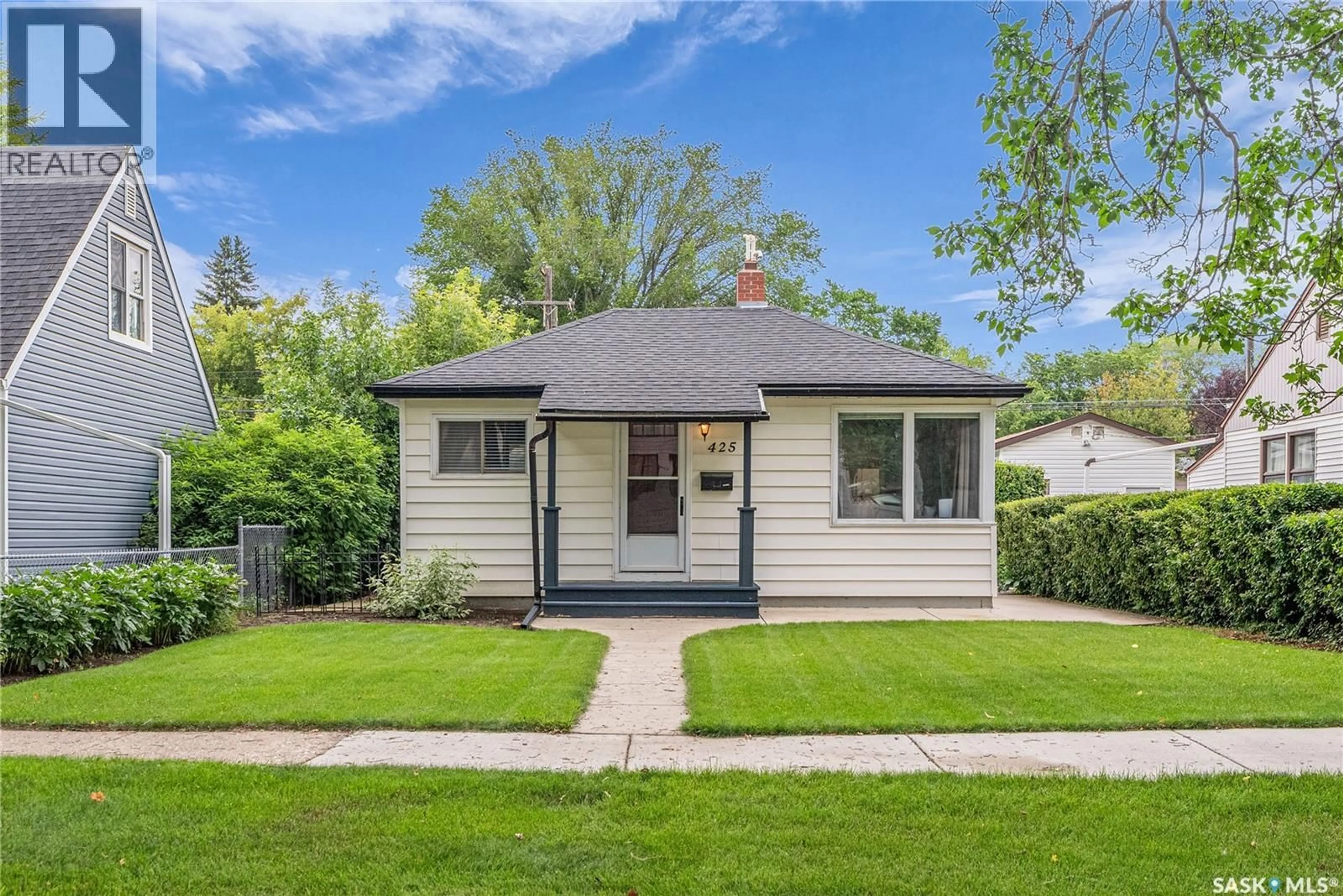 Home with vinyl exterior material, street for 425 1ST STREET, Saskatoon Saskatchewan S7H1S3