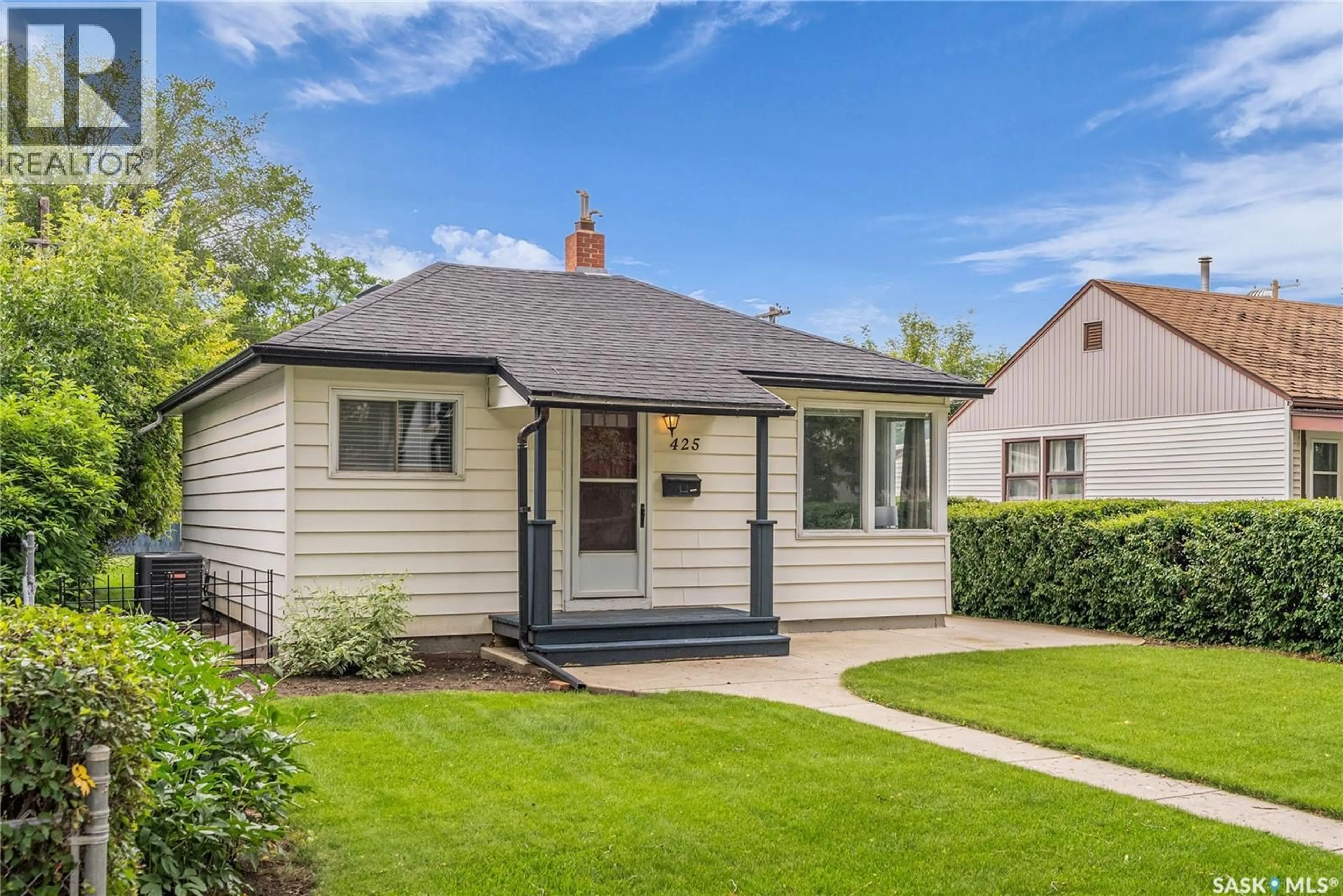 Home with vinyl exterior material, street for 425 1ST STREET, Saskatoon Saskatchewan S7H1S3