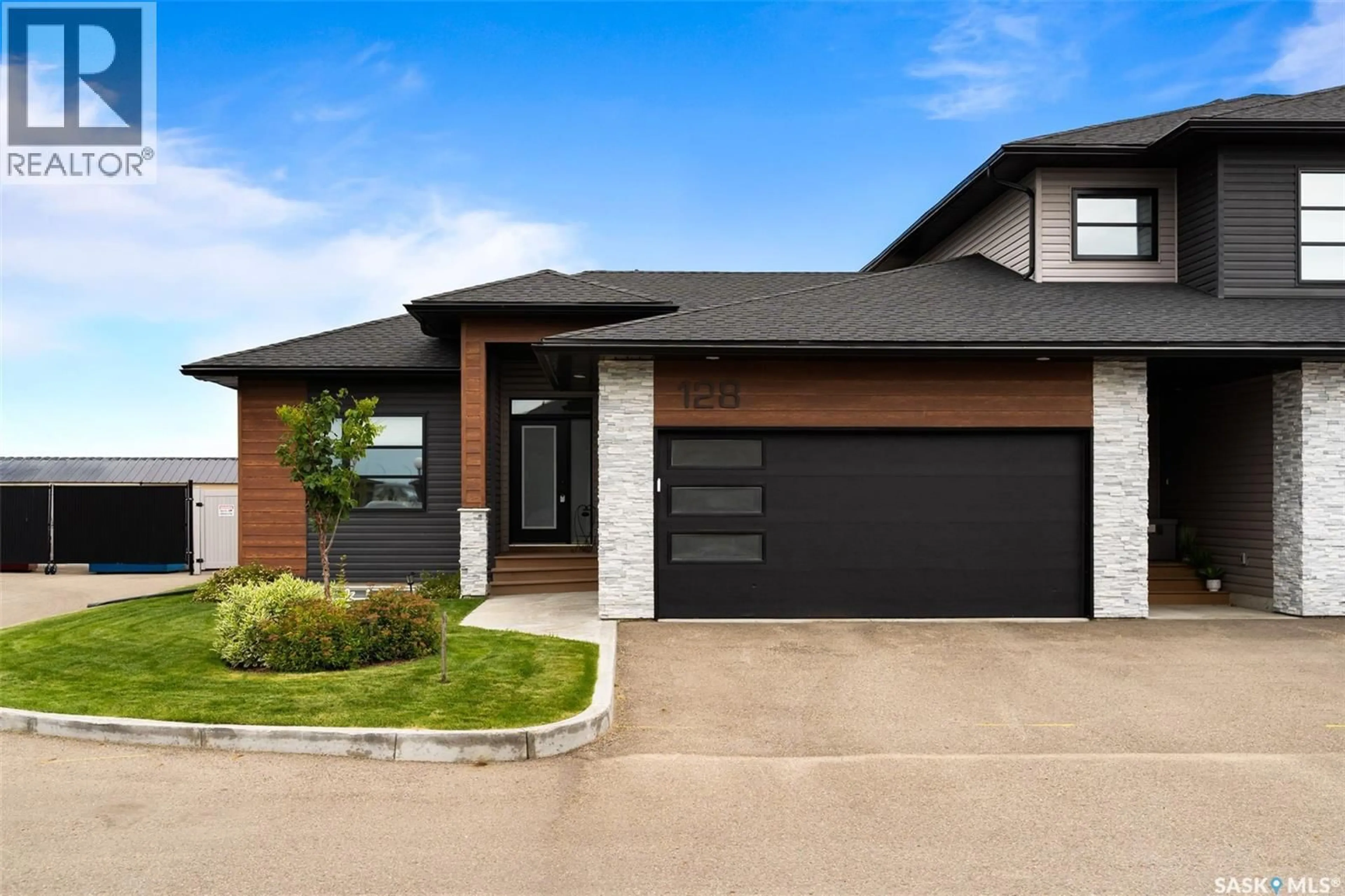 Home with brick exterior material, street for 128 - 3960 GREEN FALLS DRIVE, Regina Saskatchewan S4V3T5