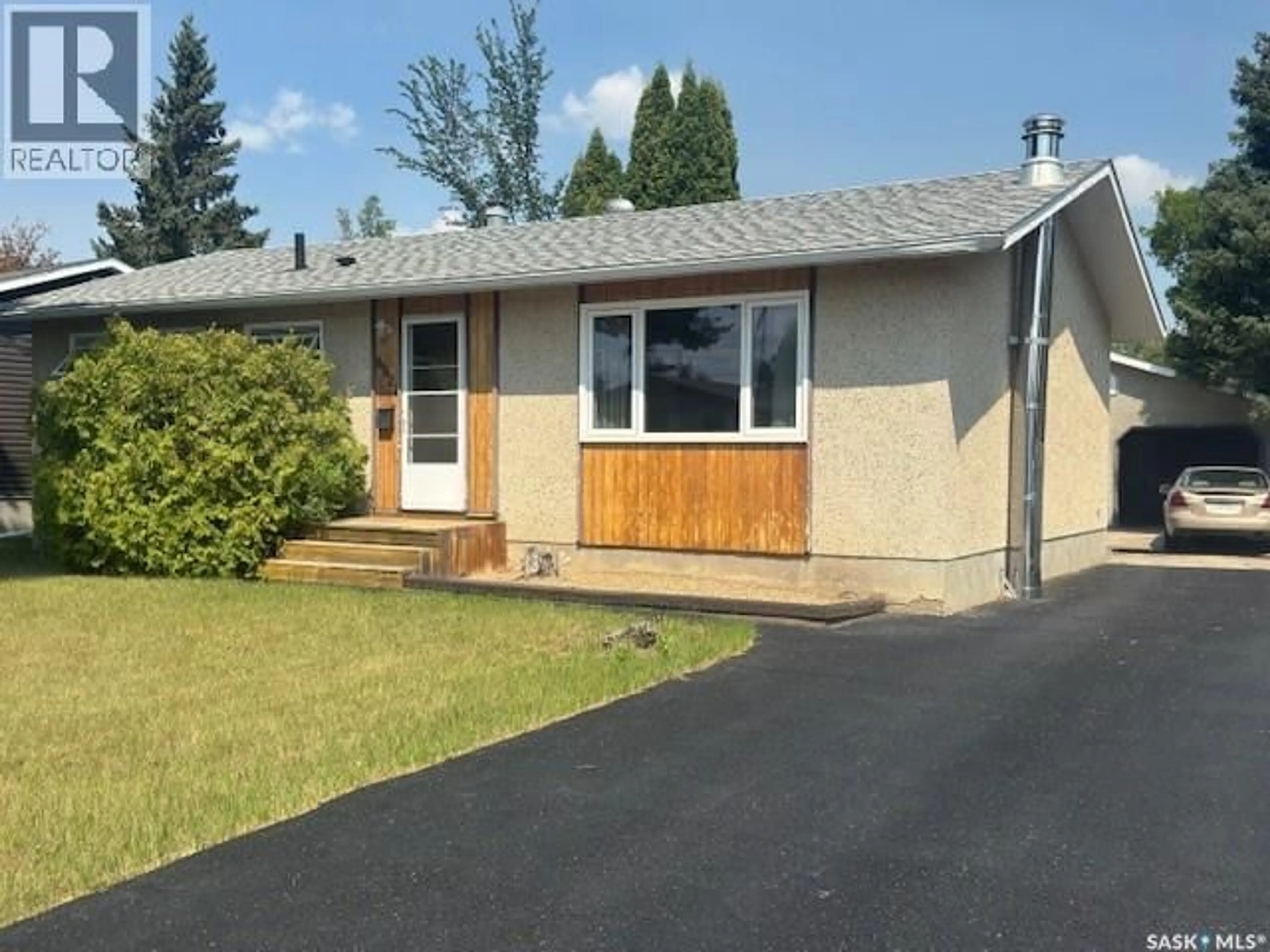 Home with vinyl exterior material, street for 8921 19TH AVENUE, North Battleford Saskatchewan S9A2V8
