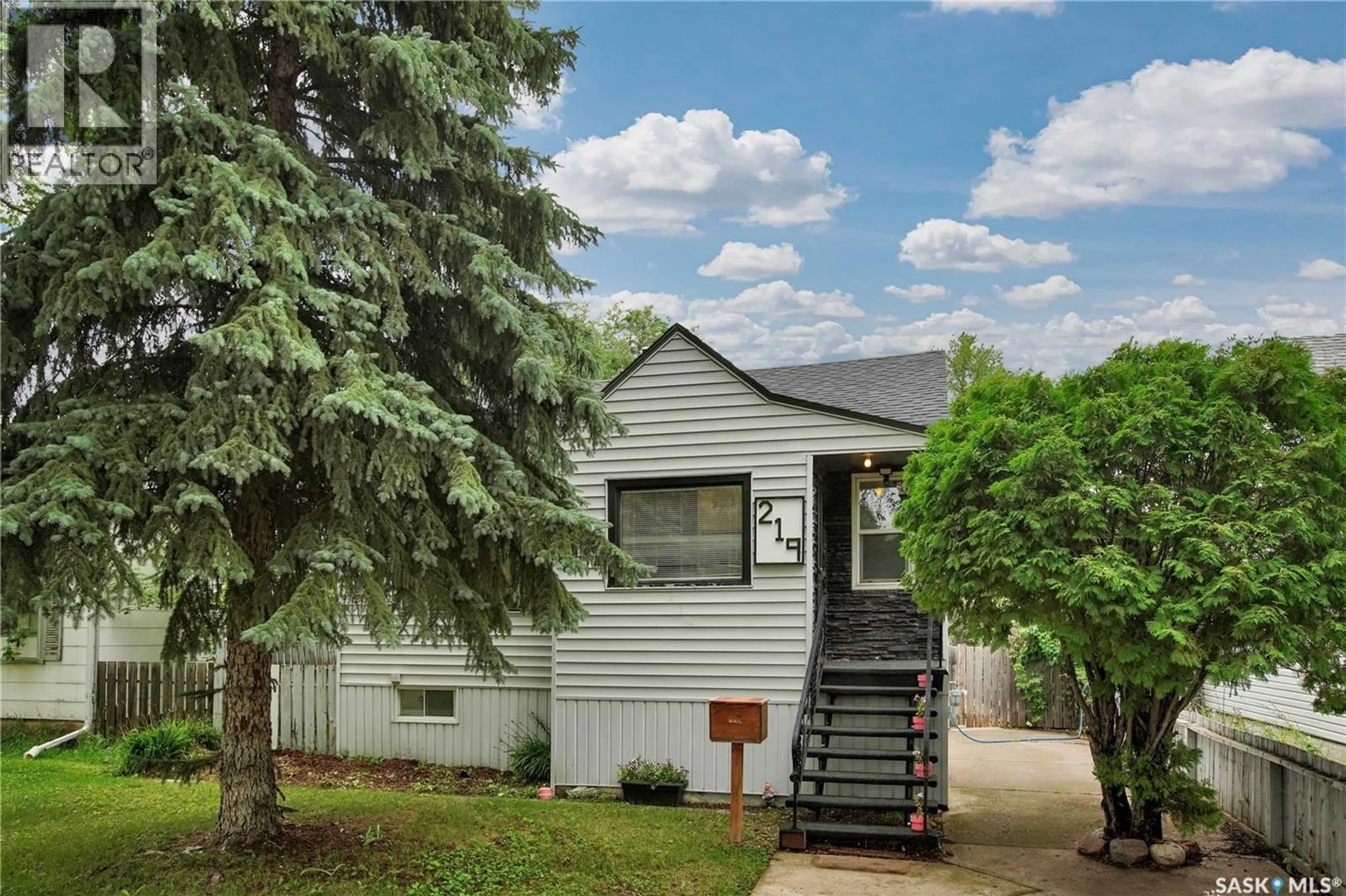 Home with vinyl exterior material, street for 219 MAPLE STREET, Saskatoon Saskatchewan S7J0A3