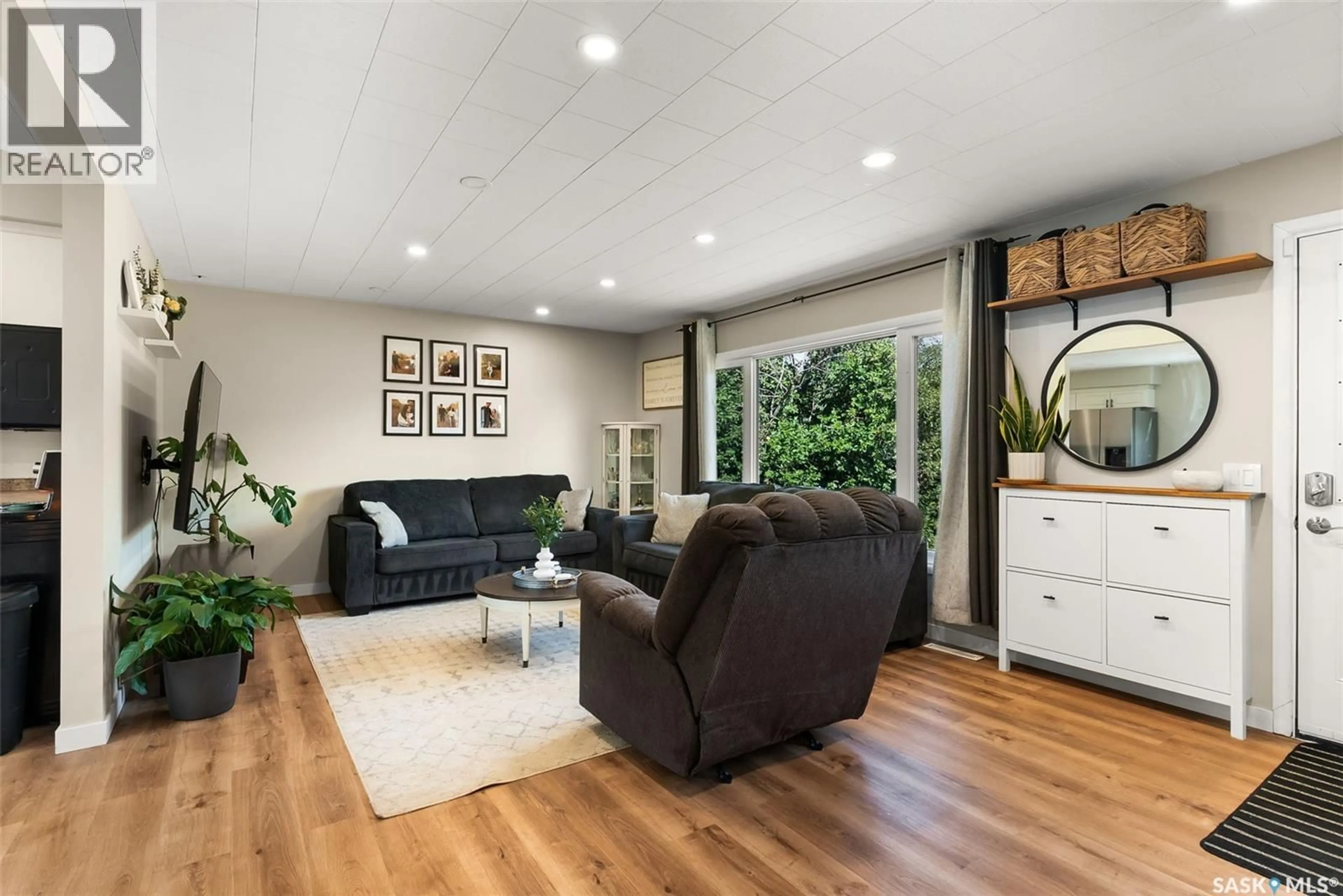 Living room with furniture, wood/laminate floor for 311 COTEAU STREET, Milestone Saskatchewan S0G3L0