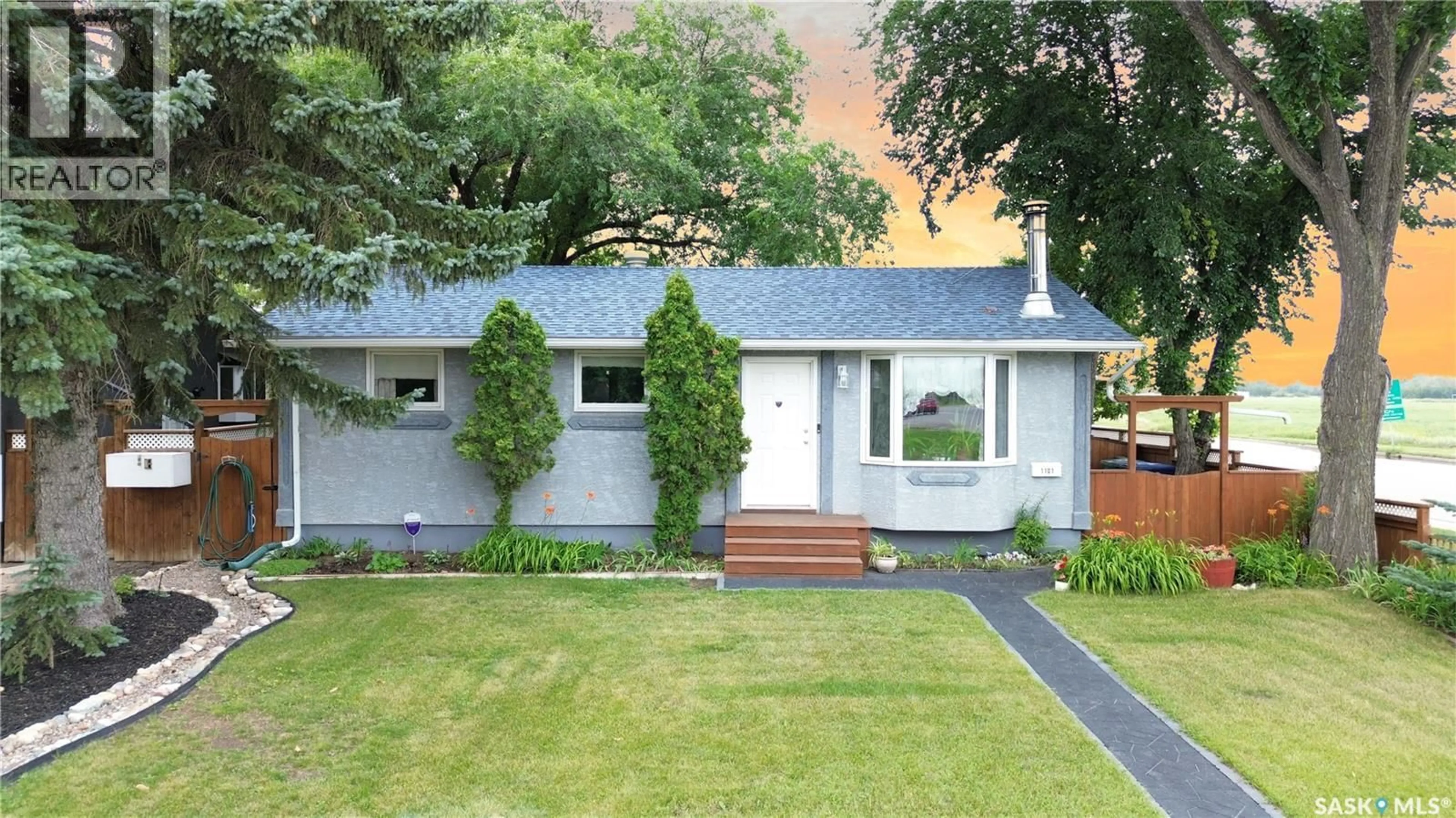 Home with vinyl exterior material, street for 1101 MCNAUGHTON AVENUE, Saskatoon Saskatchewan S7M3X6