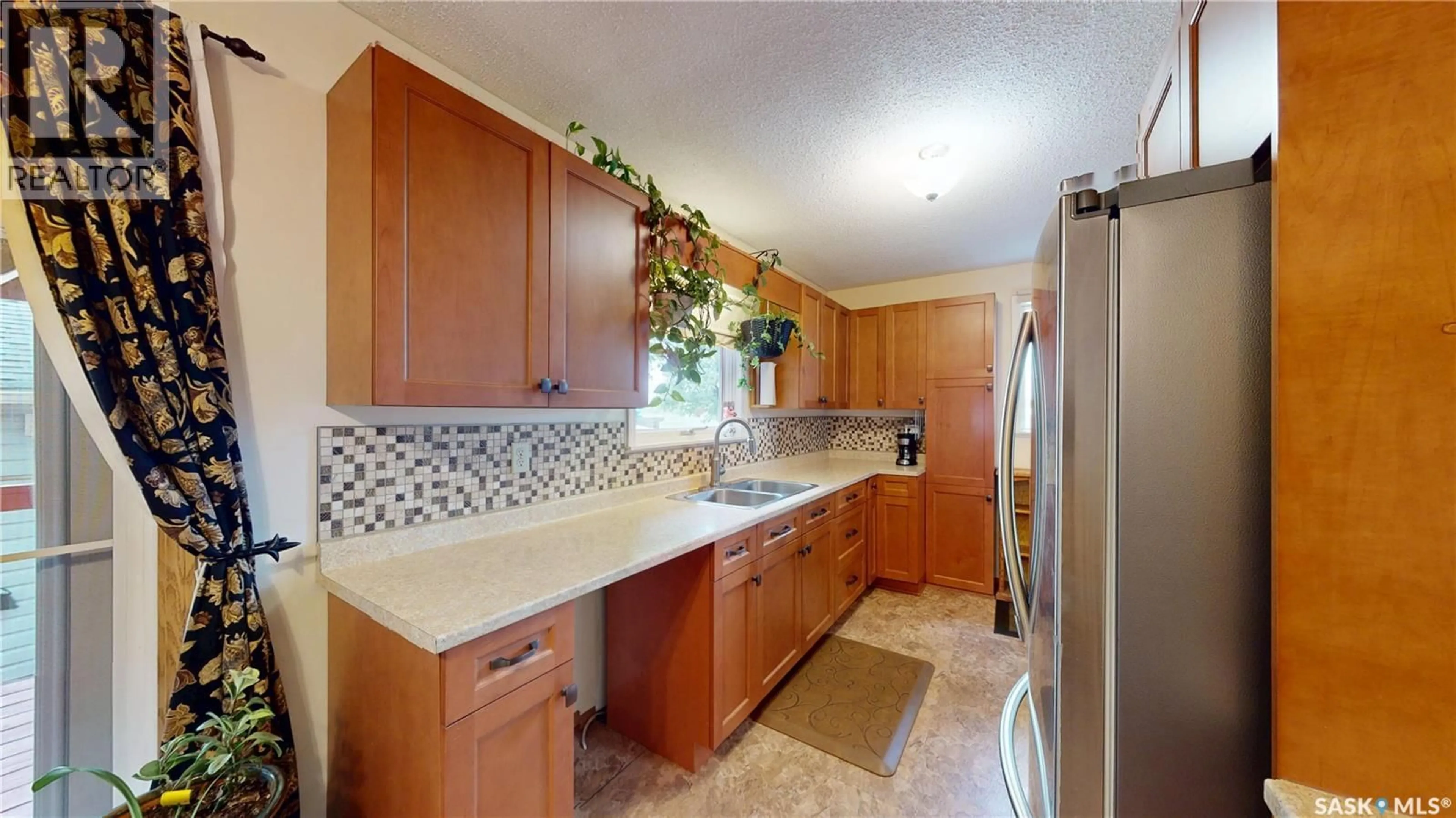 Standard kitchen, ceramic/tile floor for 1101 MCNAUGHTON AVENUE, Saskatoon Saskatchewan S7M3X6