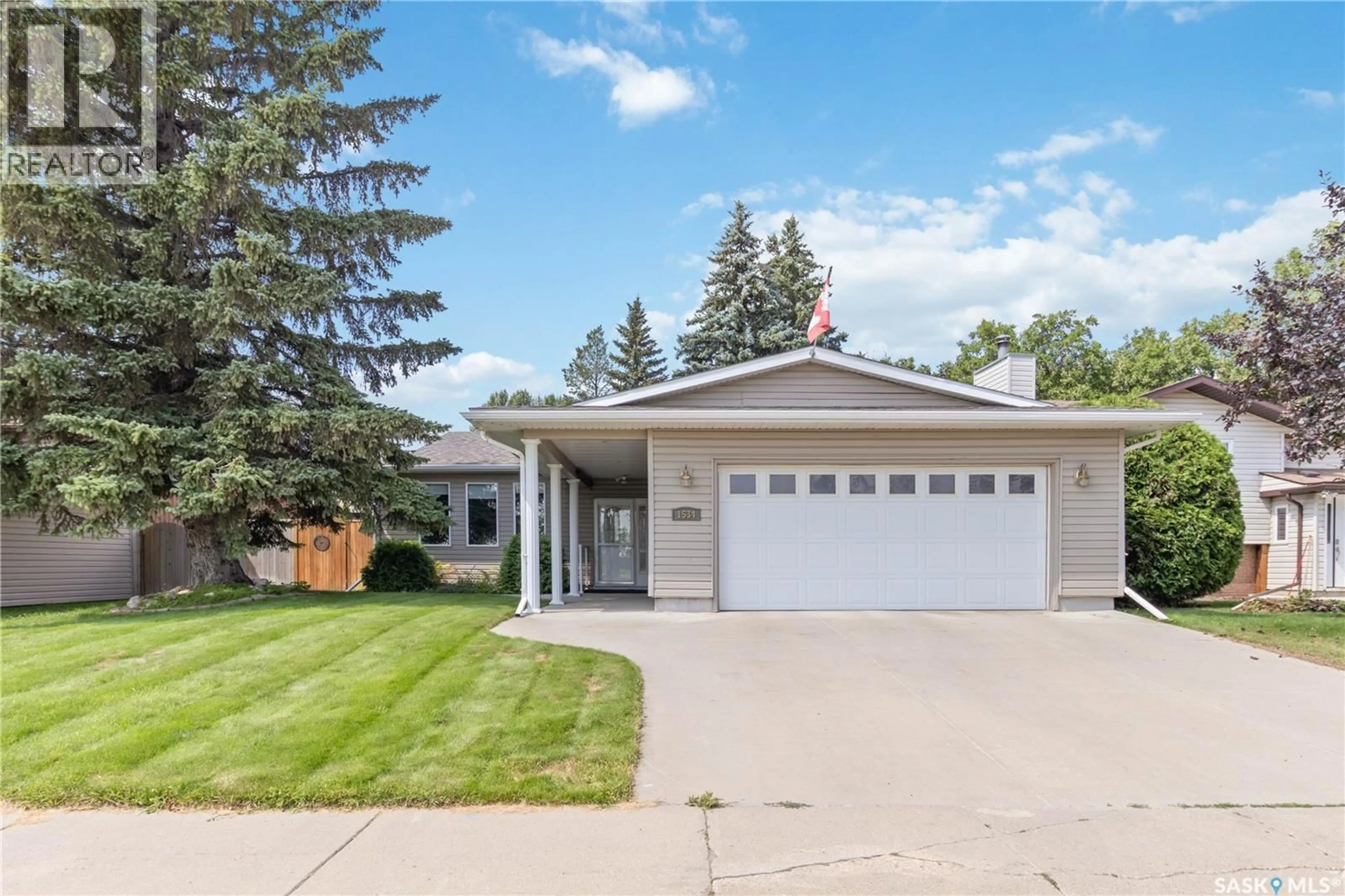 Home with vinyl exterior material, street for 1534 MCKERCHER DRIVE, Saskatoon Saskatchewan S7H5E1