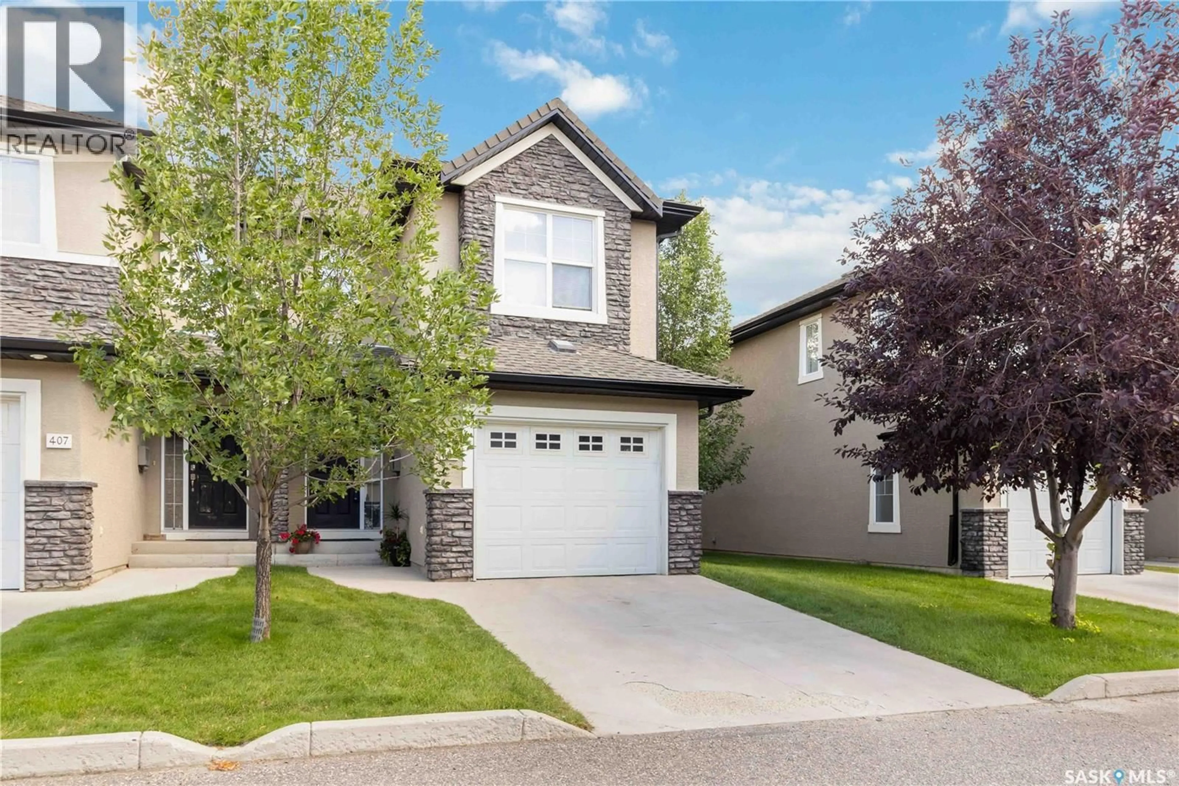 Home with vinyl exterior material, street for 410 - 406 HUNTER ROAD, Saskatoon Saskatchewan S7T0L5