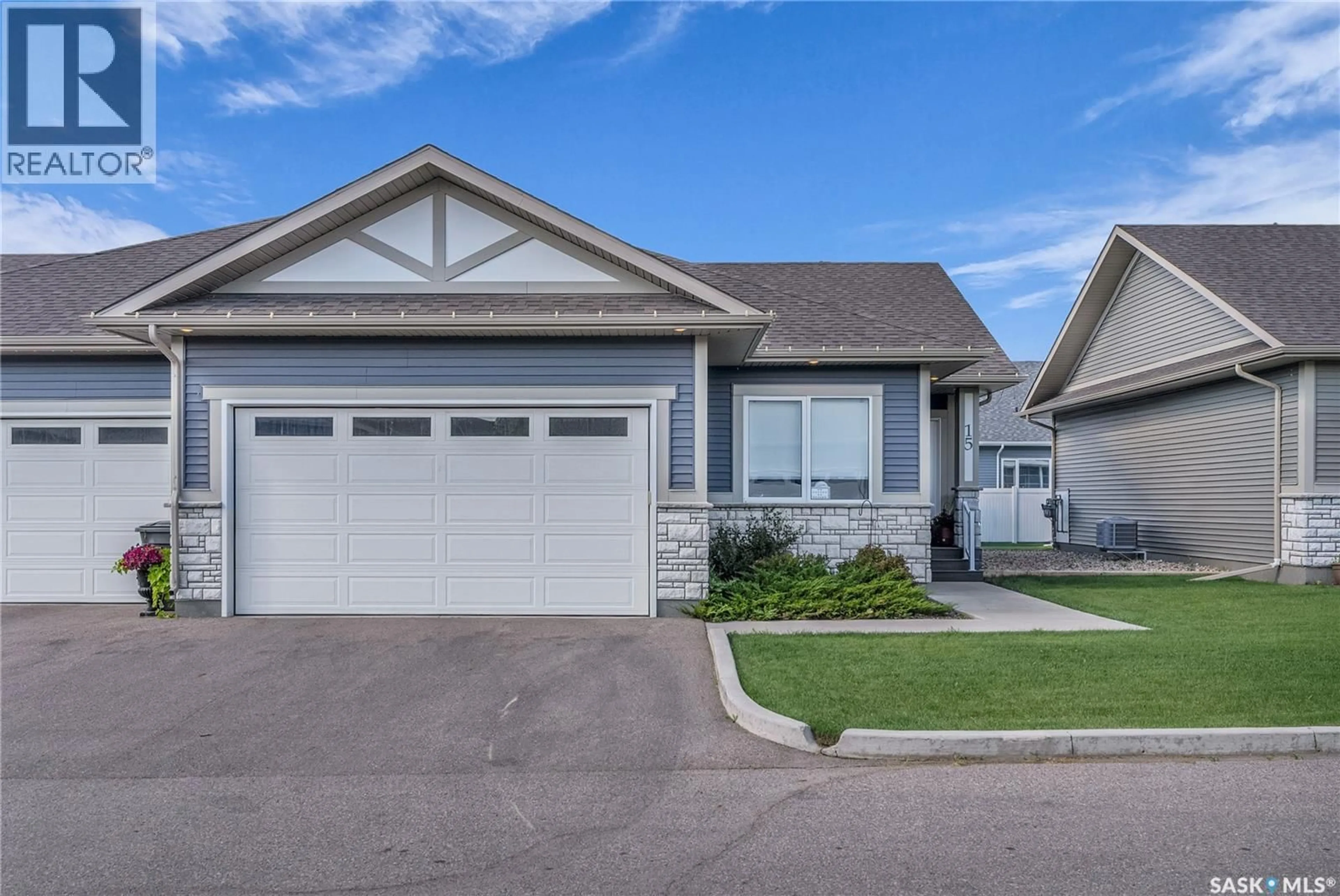 Home with vinyl exterior material, street for 15 PALMER CRESCENT, Warman Saskatchewan S0K4S1