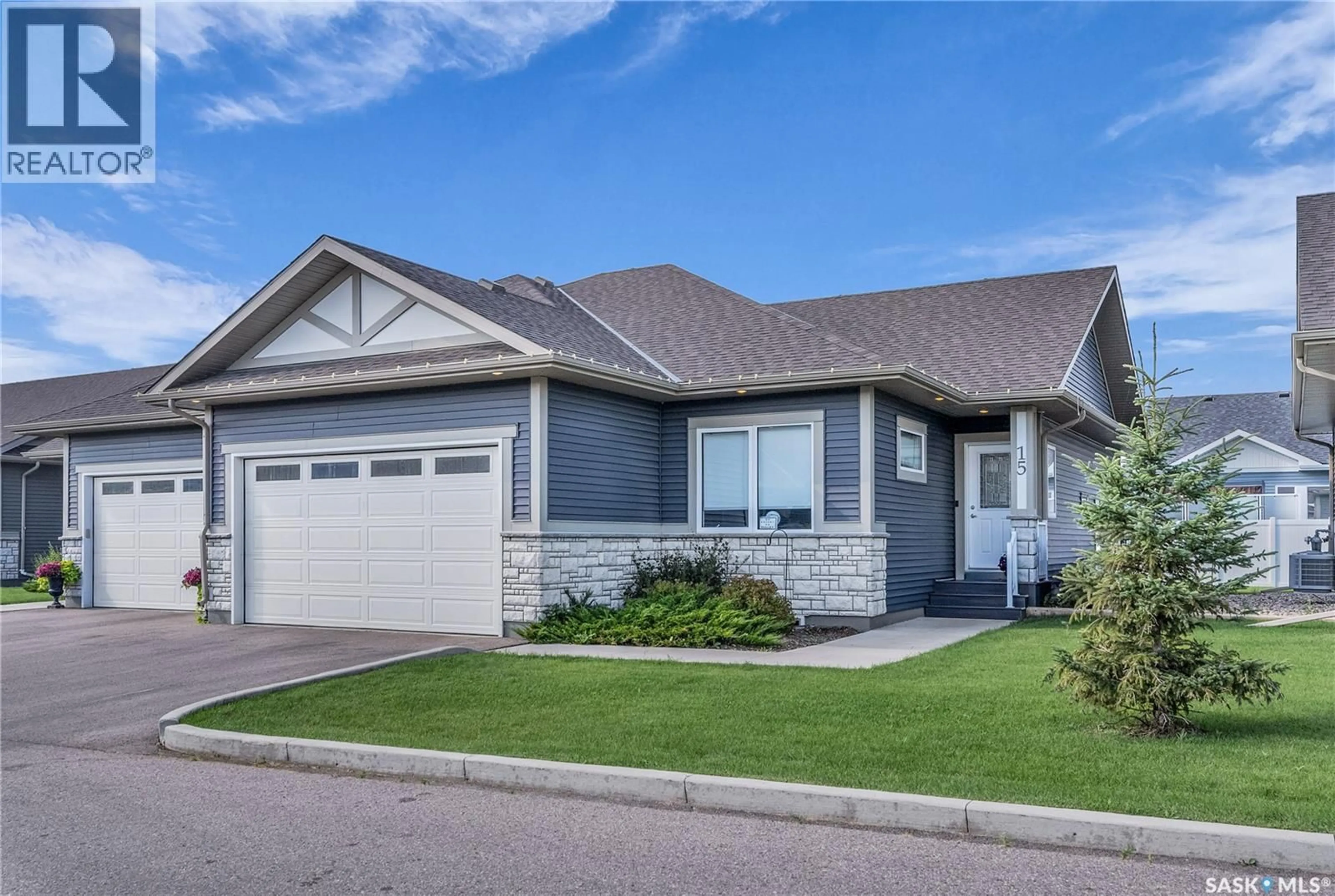 Home with vinyl exterior material, street for 15 PALMER CRESCENT, Warman Saskatchewan S0K4S1