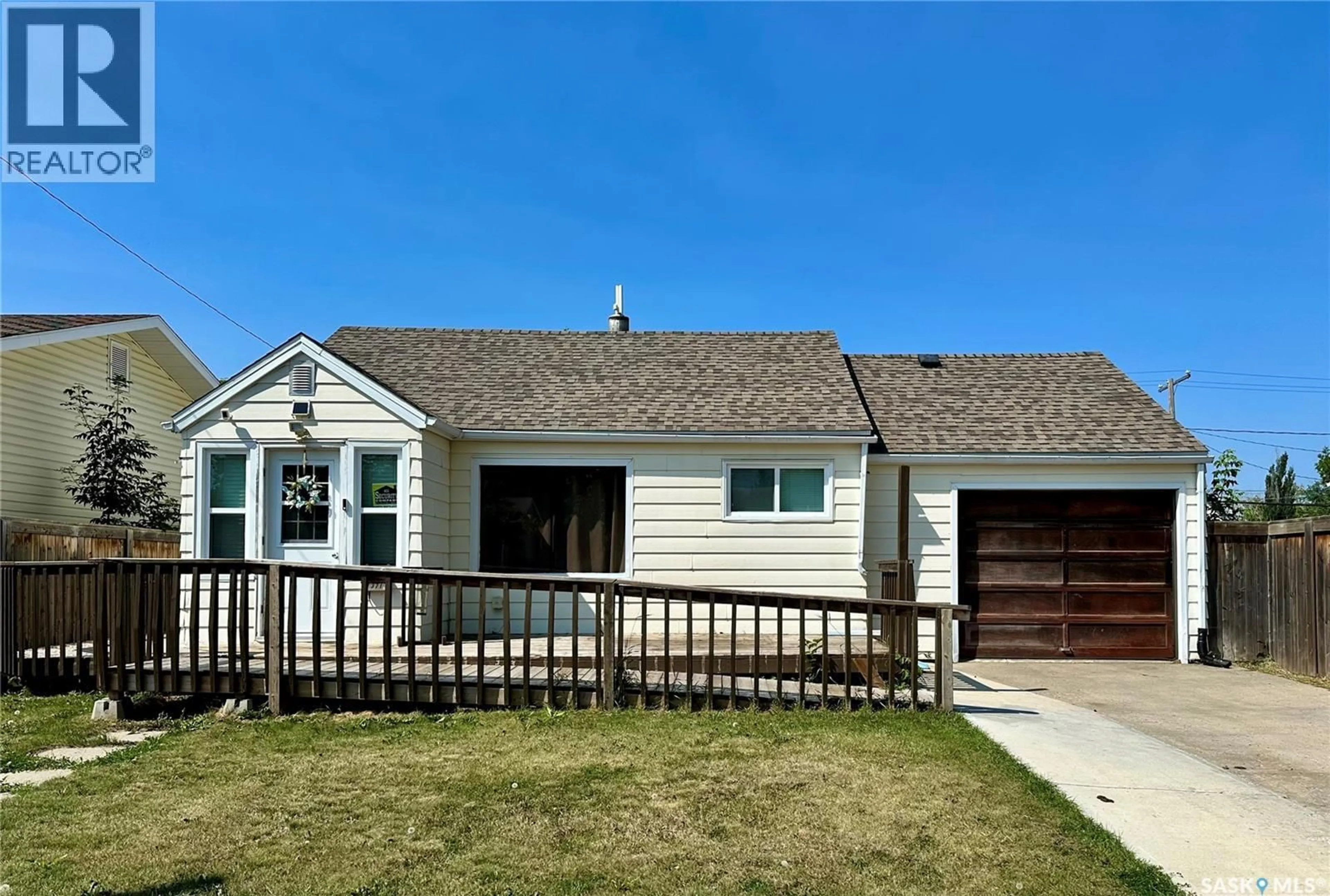 Home with vinyl exterior material, street for 1371 106TH STREET, North Battleford Saskatchewan S9A1X3