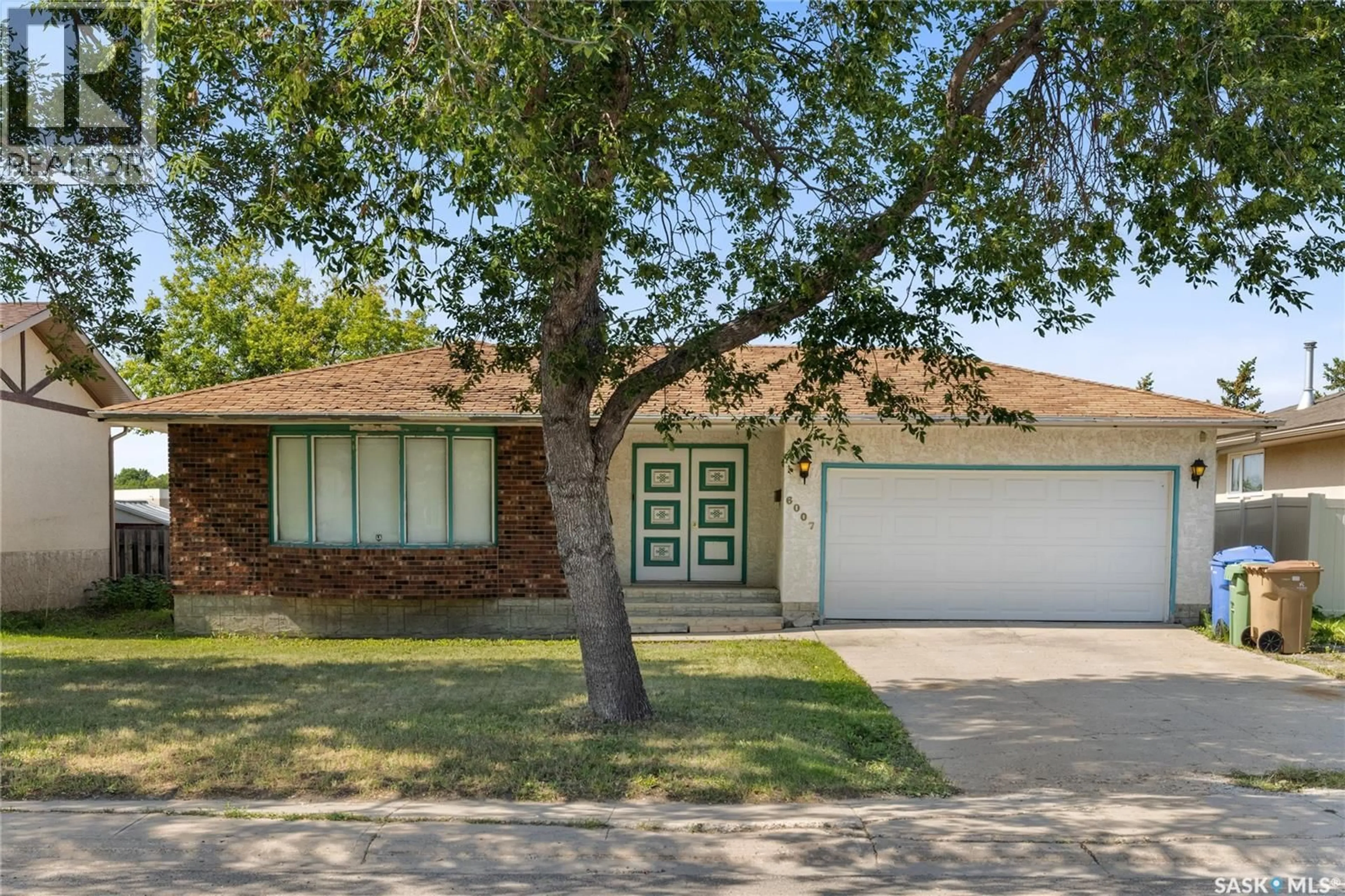 Home with brick exterior material, street for 6007 SHERWOOD DRIVE, Regina Saskatchewan S4T6X5
